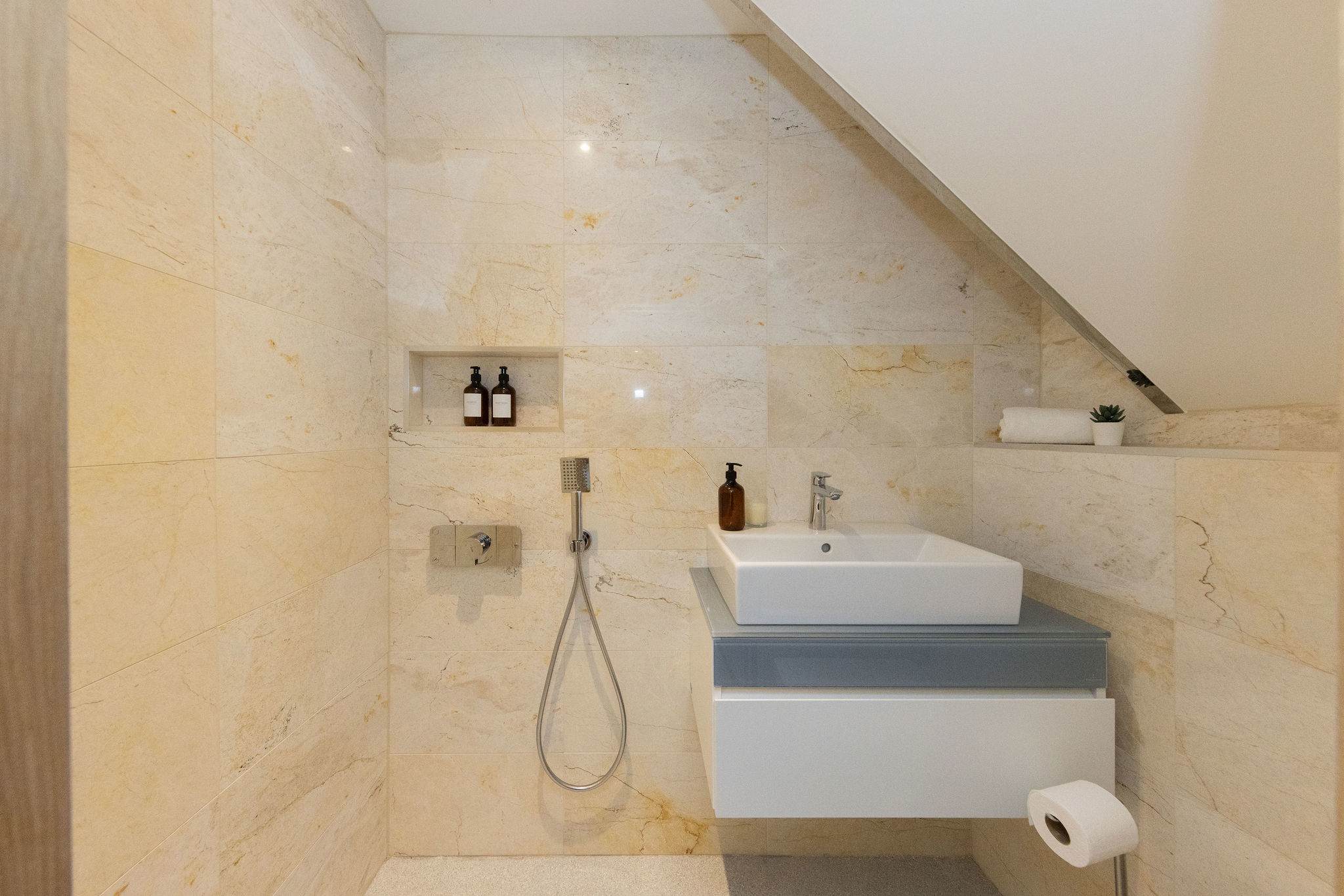 Bedroom 4- small en suite bathroom with shower, sink and wc!