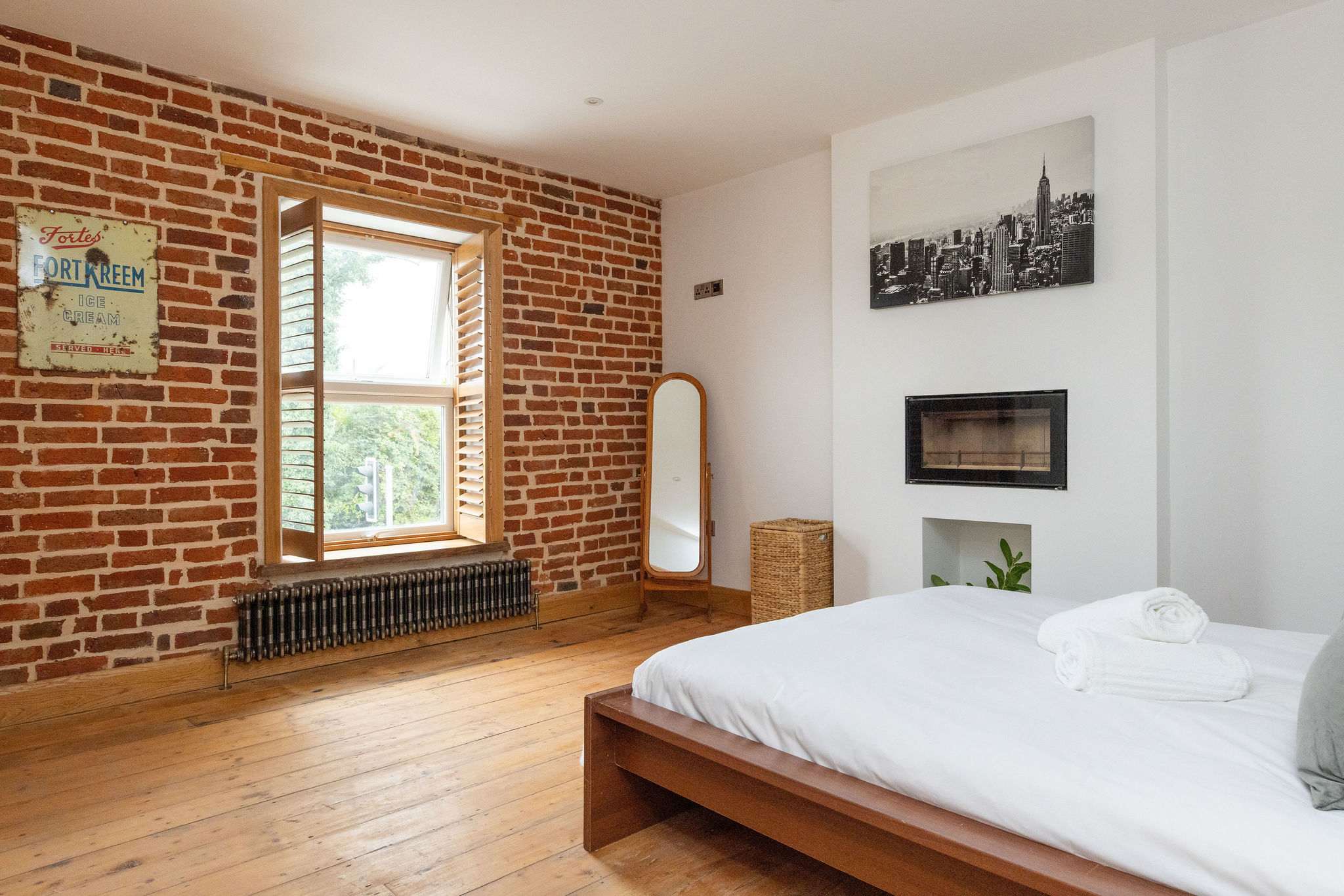 Bedroom 1- Open up the shutters to welcome in the daylight.
