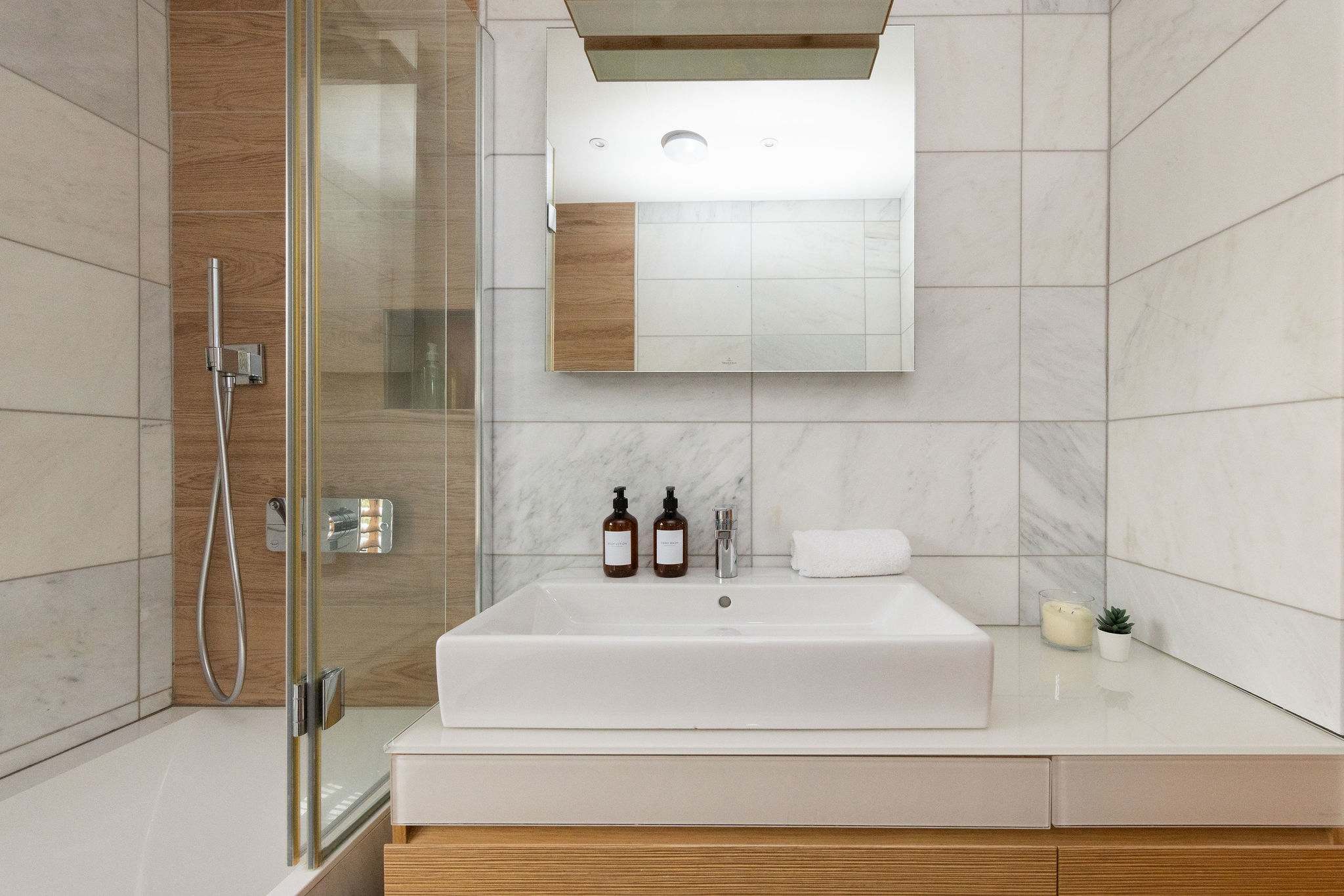 Sink with overhead mirror.