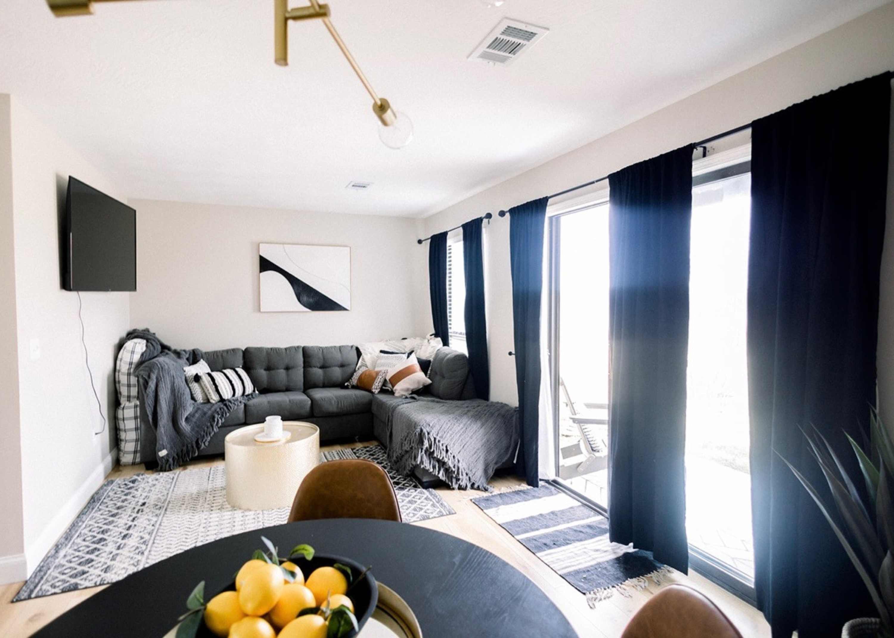 Curl up in the chic living room & stream your favorites on the smart TV​