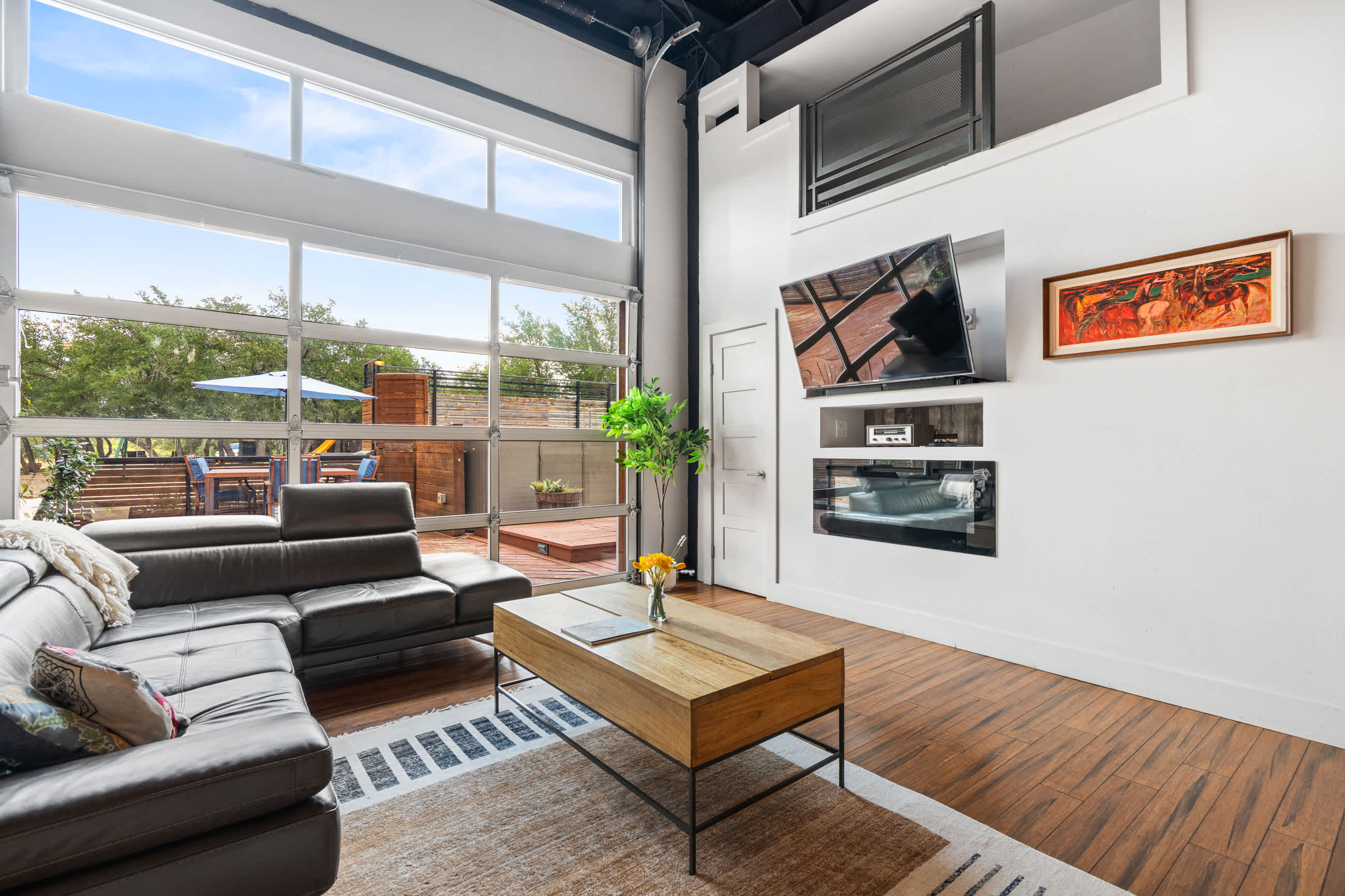 Contemporary Living Area with High Ceilings and Smart TV