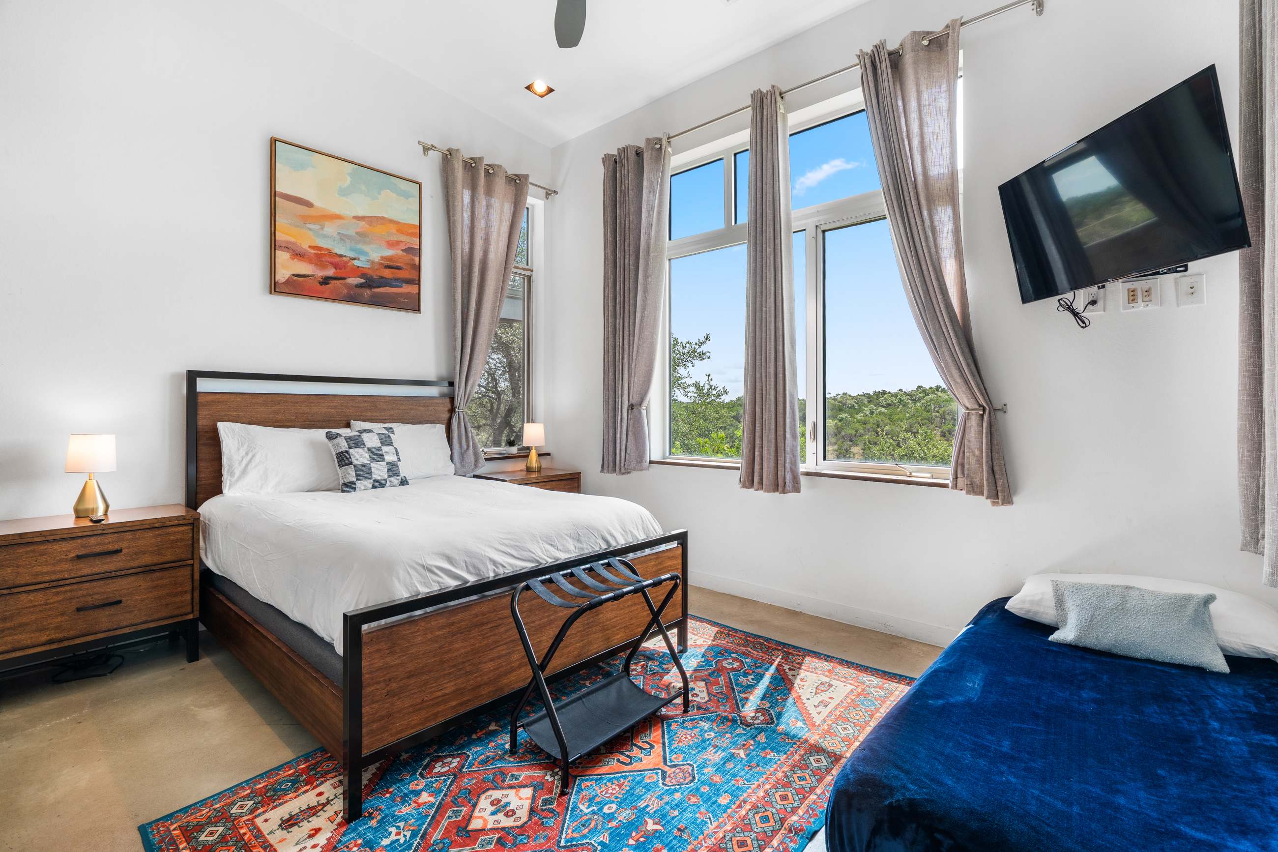 Second Bedroom with natural light and smart TV