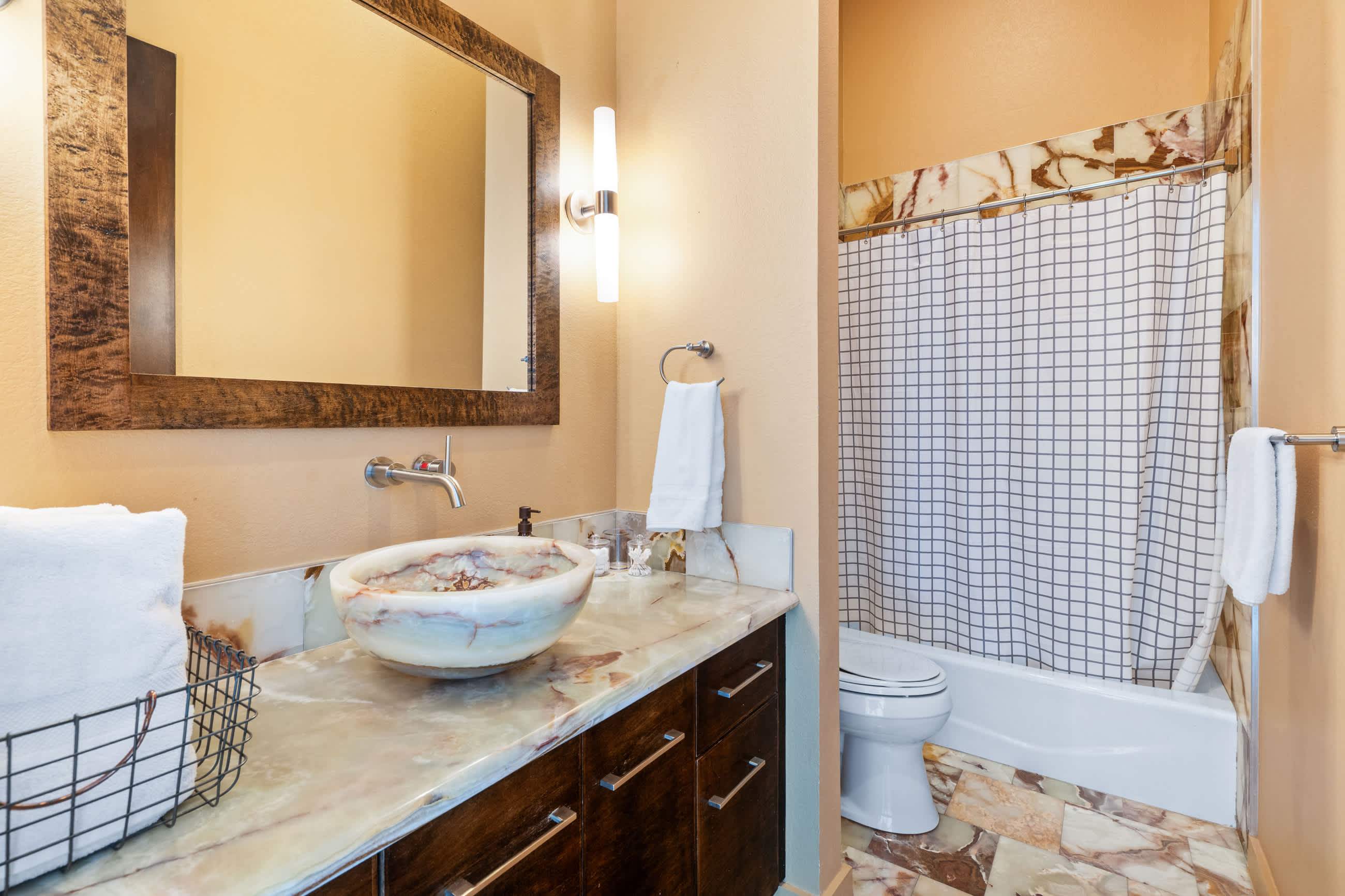 Full bathroom with combined bathtub and shower