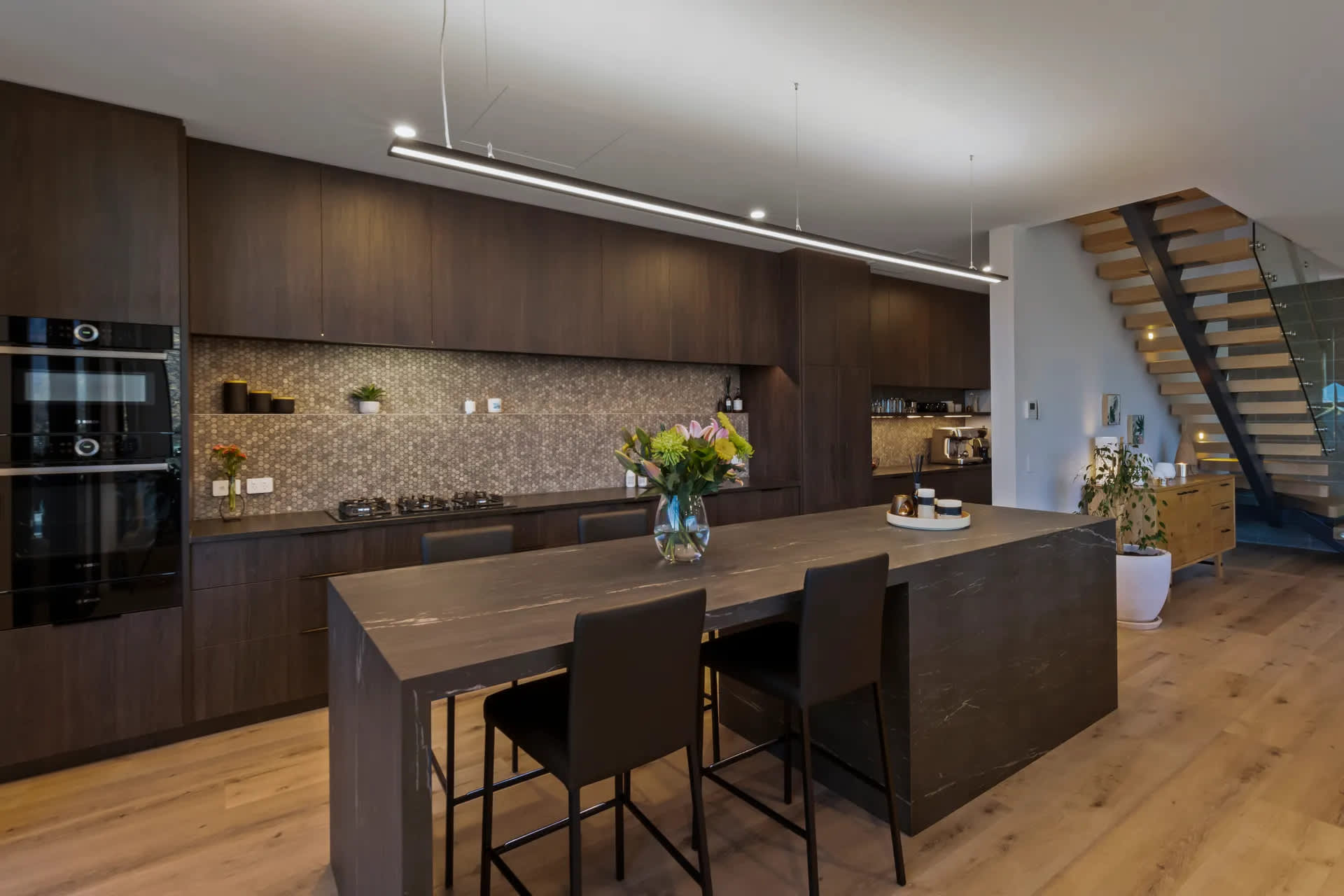 Modern Queenstown villa kitchen with island bench, lake views and Nespresso coffee machine