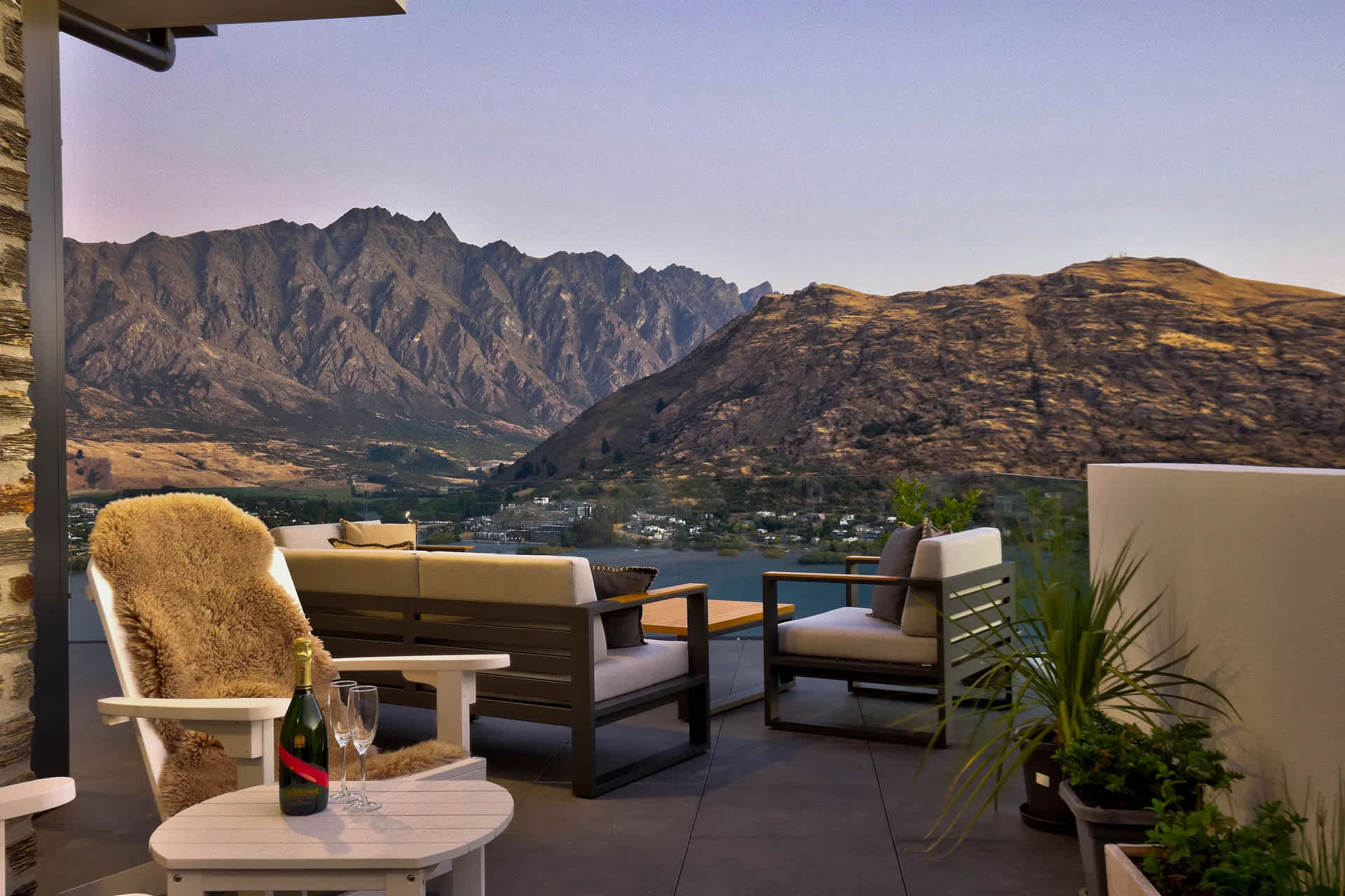 Queenstown luxury villa balcony with outdoor seating and breathtaking alpine views
