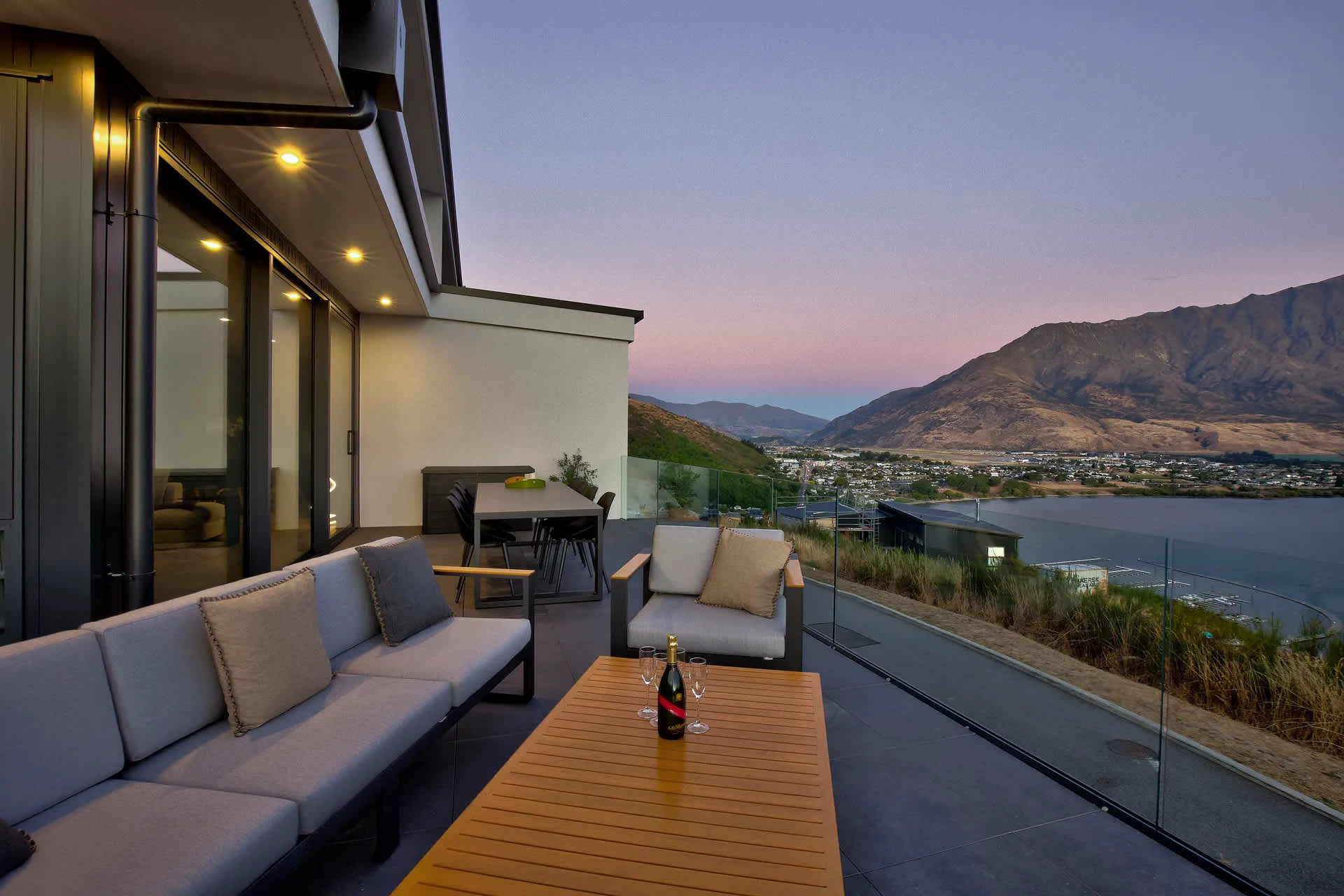 Private Queenstown villa balcony with panoramic lakefront and Remarkables views