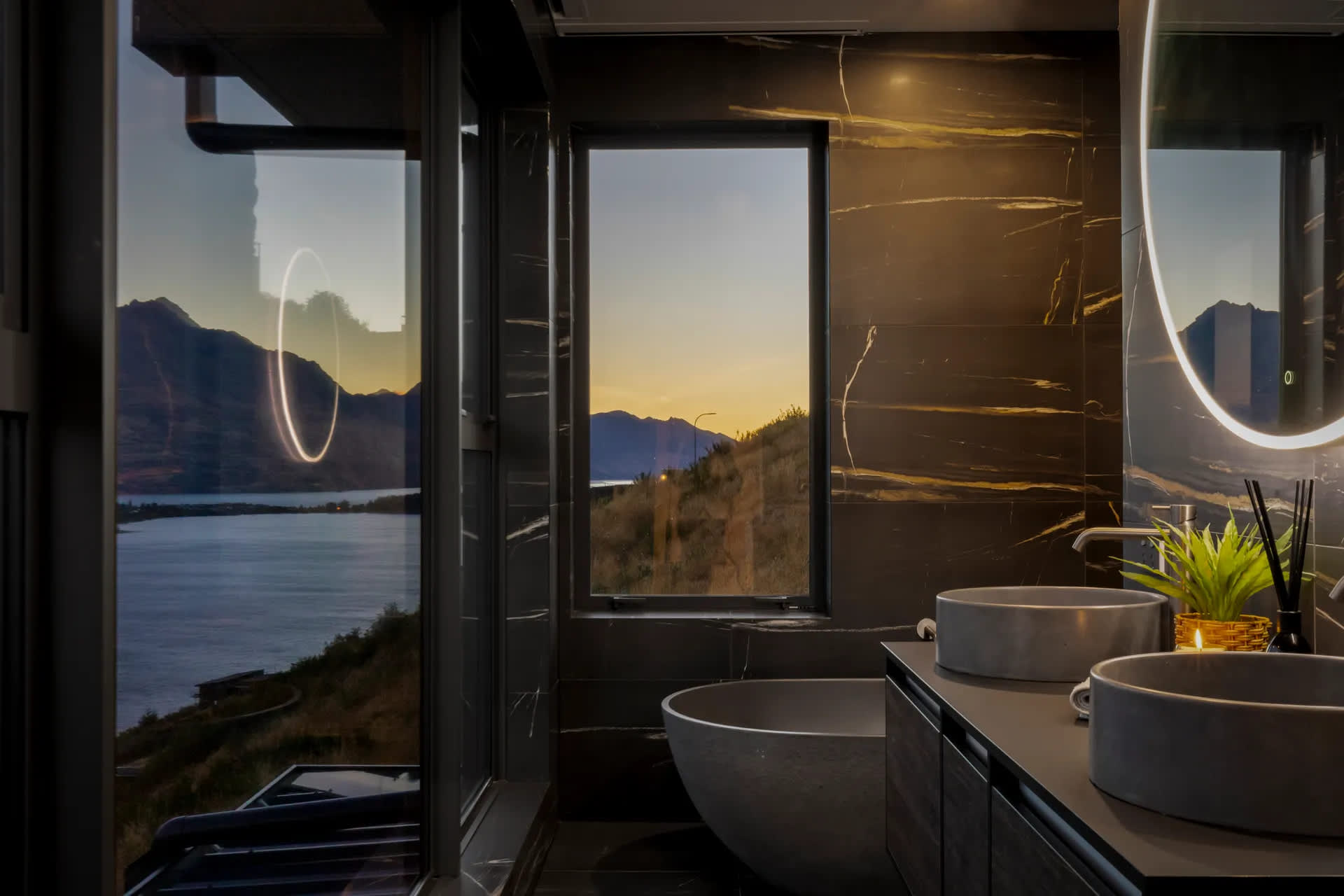 Luxury ensuite bathroom with freestanding tub. With lake & mountain views in Queenstown villa