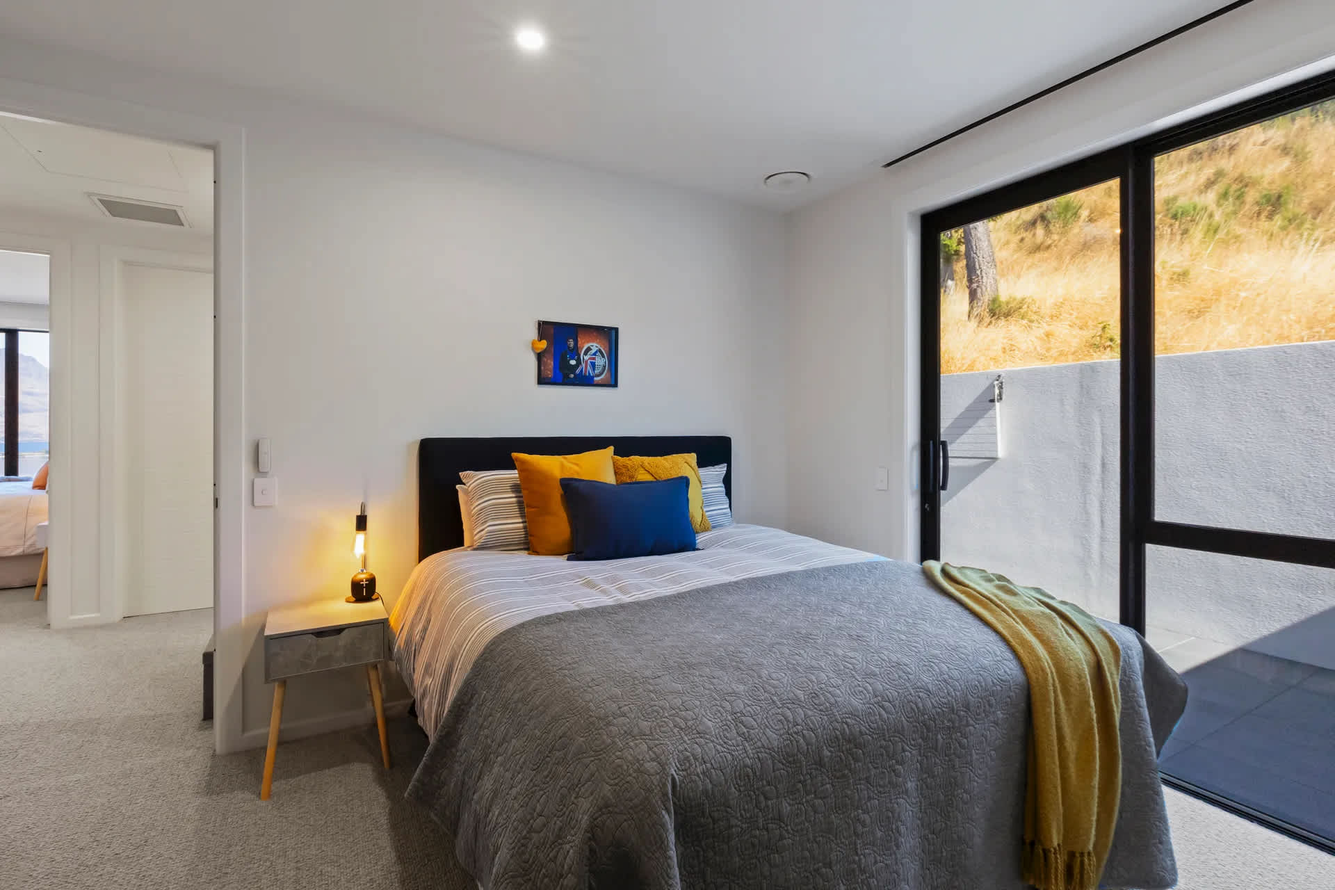 Fourth Bedroom: Modern Queenstown Hill villa bedroom with natural light and storage