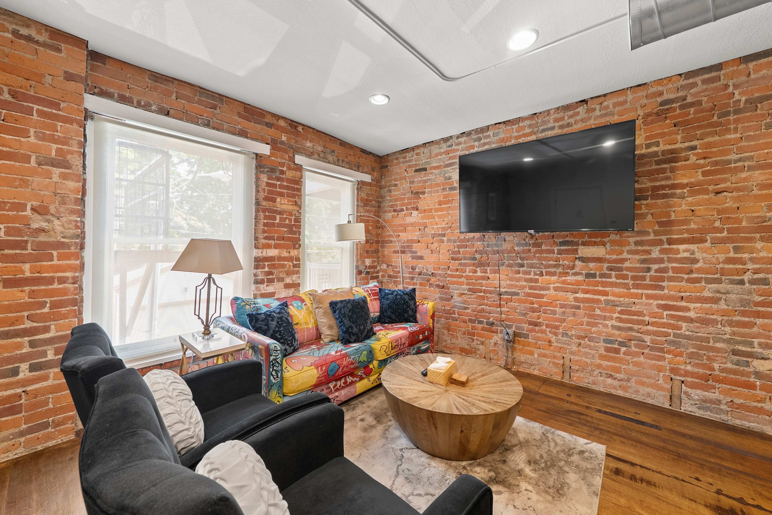 Curl up in the chic living room & stream your favorites on the smart TV​