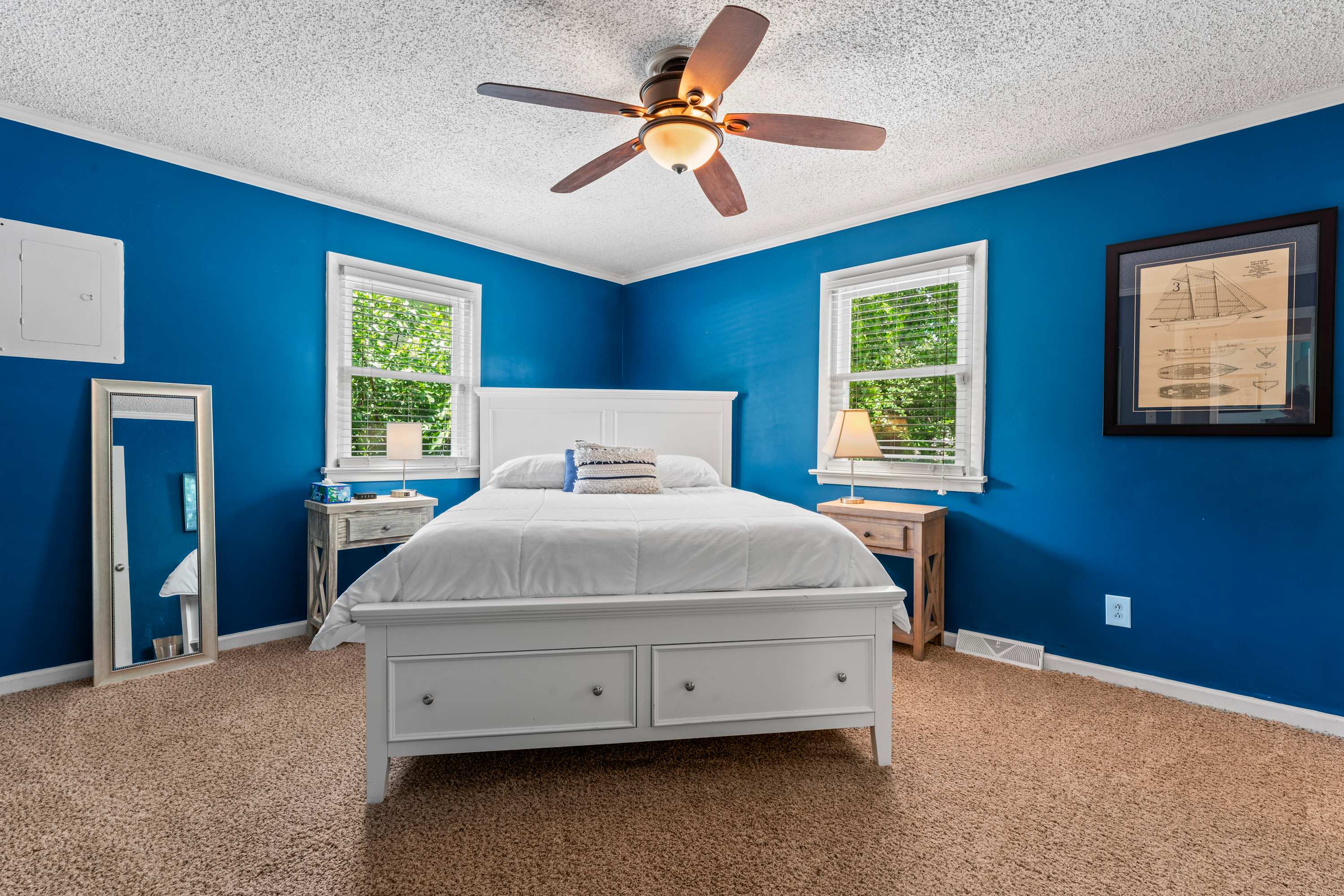 Relax in the master bedroom with a queen bed and smart TV