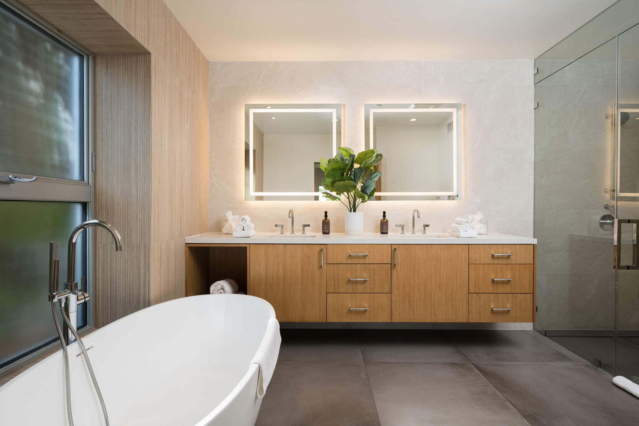 Primary bathroom comes equipped with a walk-in steam shower, Kohler Smart Toilet and large double sink for 2.
