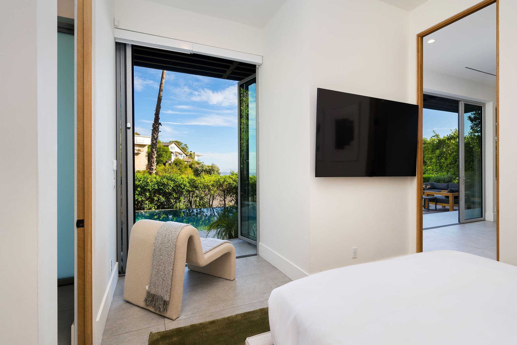 Guest bedroom #4 with a king size bed, Smart TV and full bathroom.