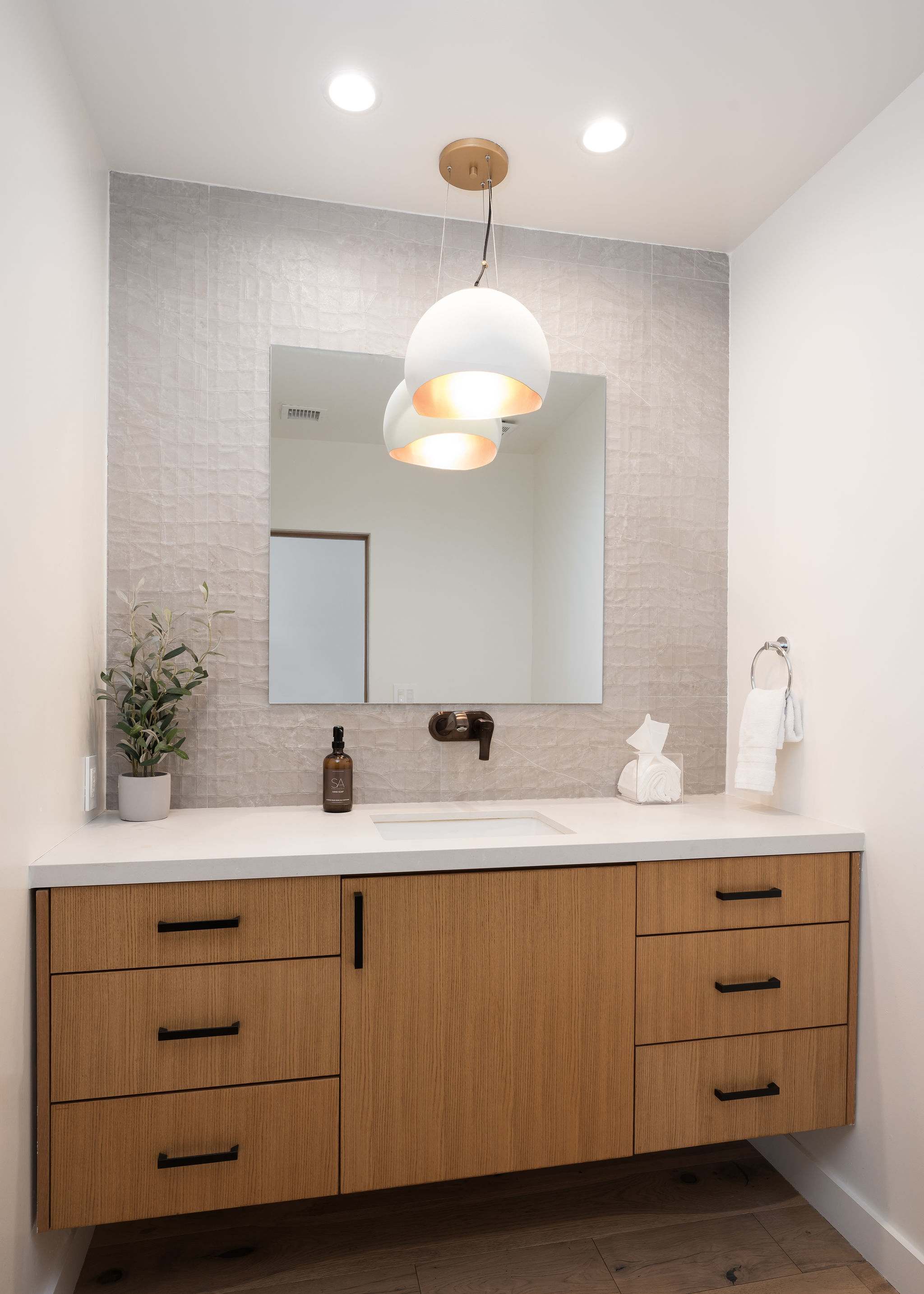 Powder bathroom with smart toilet located on the 1st floor.
