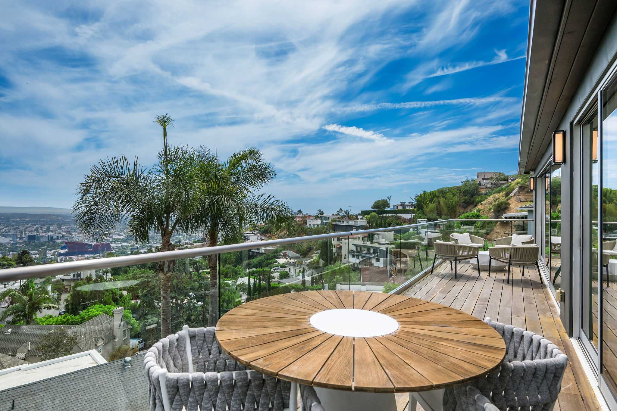 Outdoor table with seating for 4 for light meals and views of the city skyline.