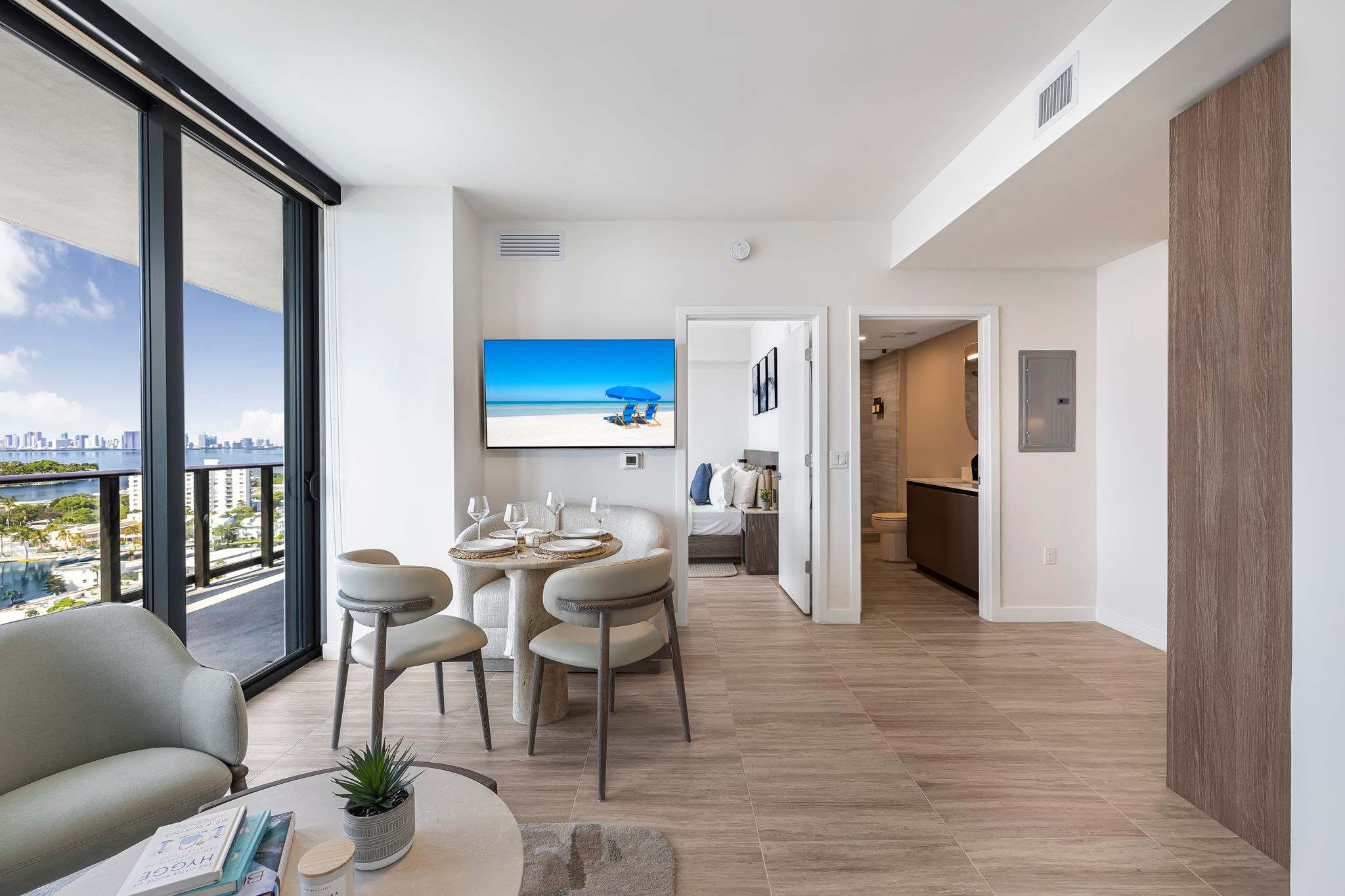 Experience urban luxury with breathtaking city views from this stylish living space, perfect for relaxation and entertainment.