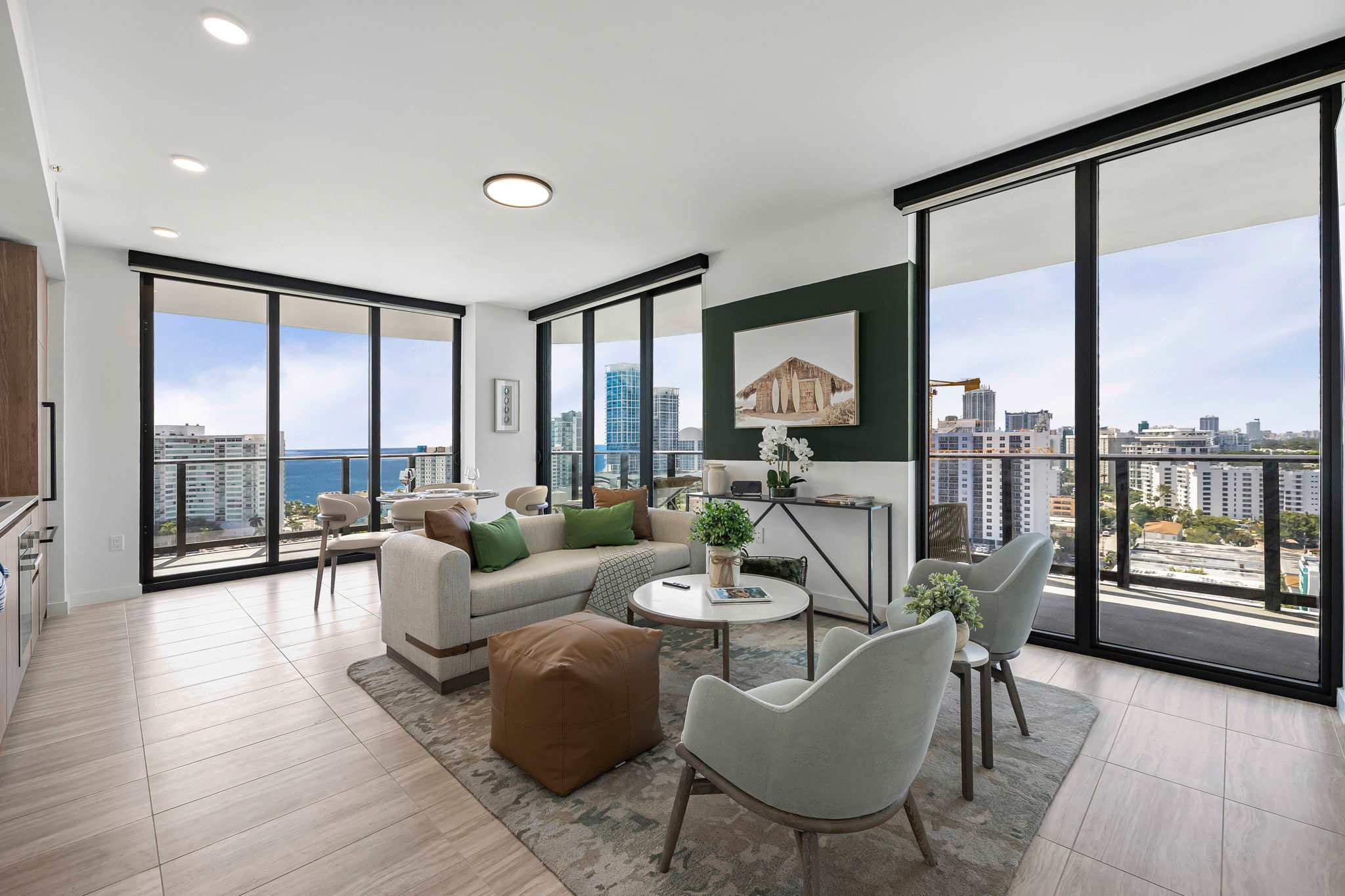 Experience breathtaking city and ocean views from this stylish living room, perfect for relaxation and entertaining.