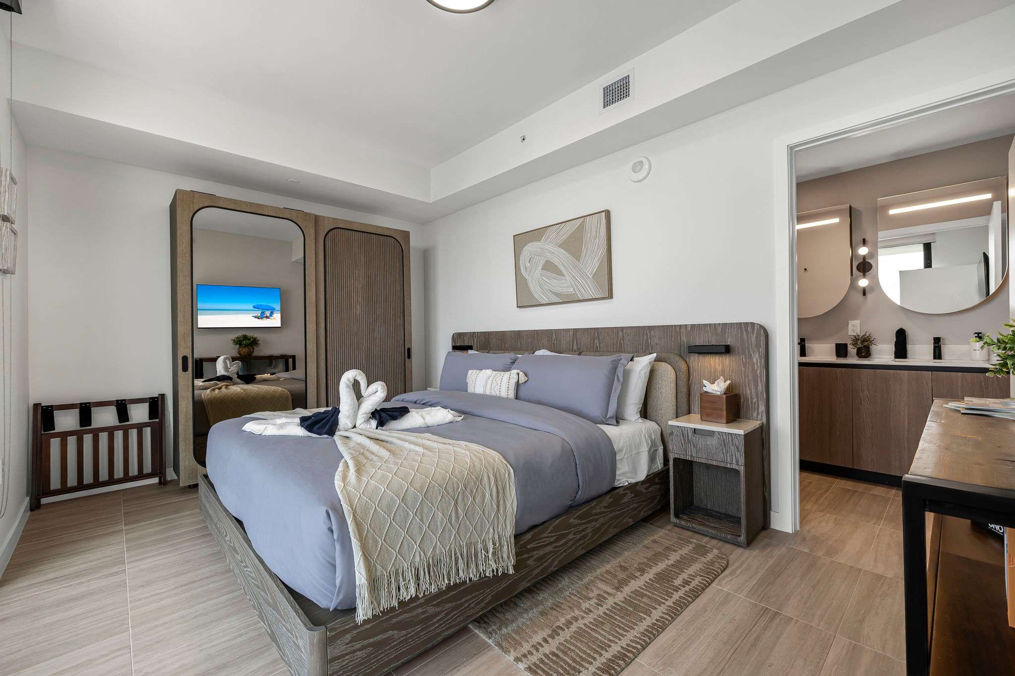 Relax in this stylish bedroom with modern amenities and a cozy ambiance, perfect for unwinding after a day of exploring.