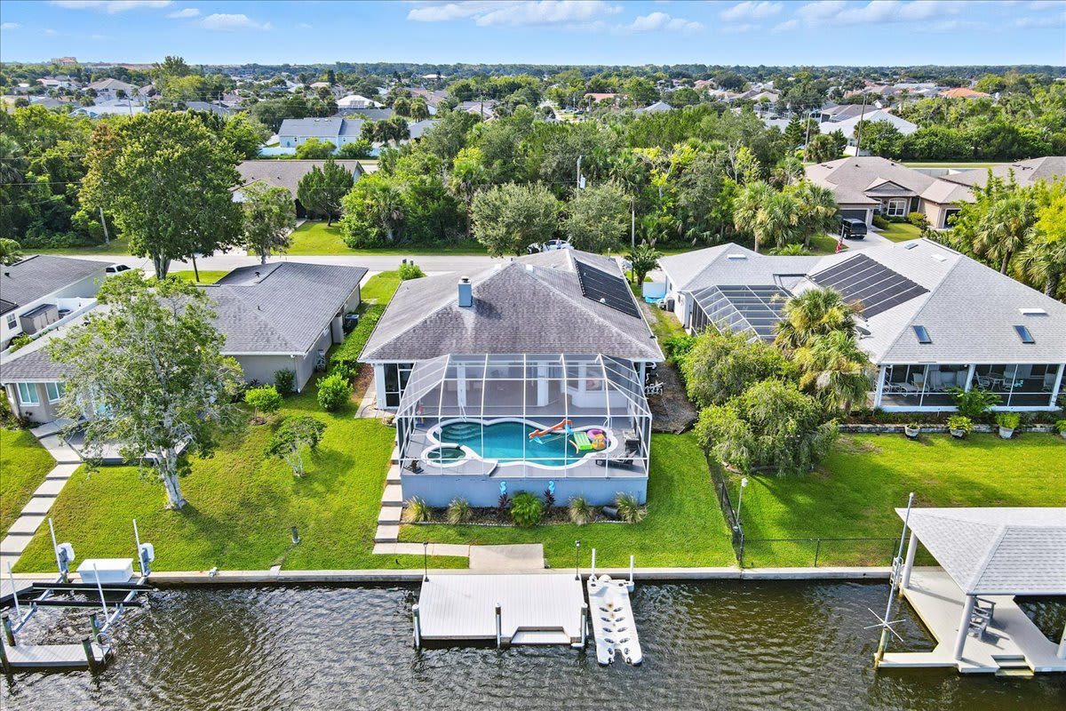 Family Canal Retreat w/ Pool, Dock & Sunset Views