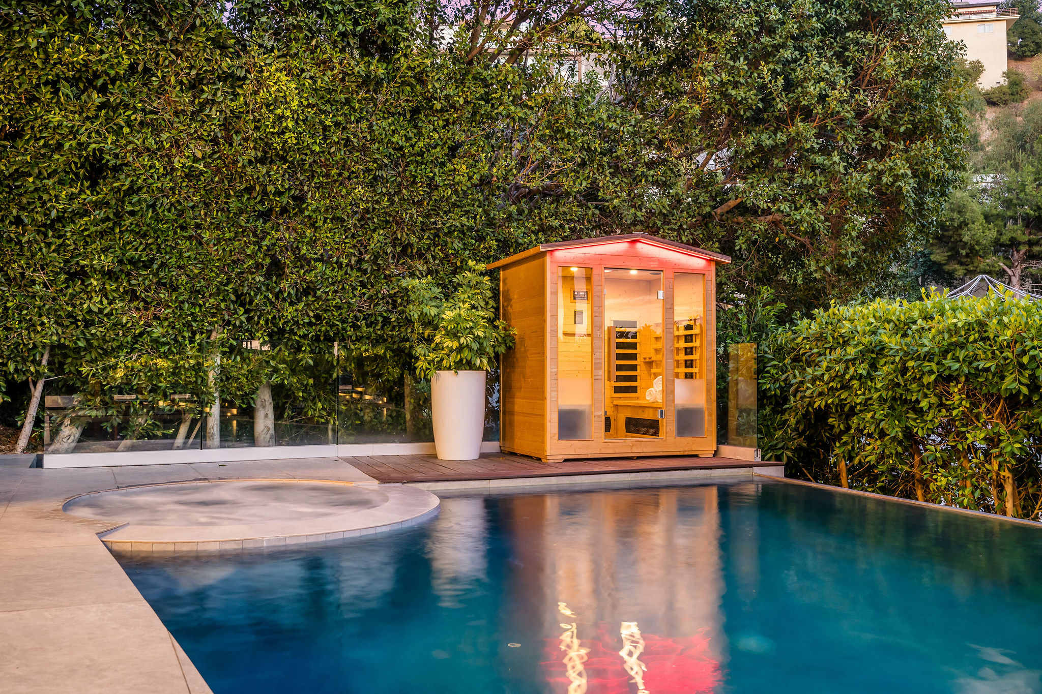 Outdoor sauna for 2 near the hot tub and pool to add to your health and wellness regime.