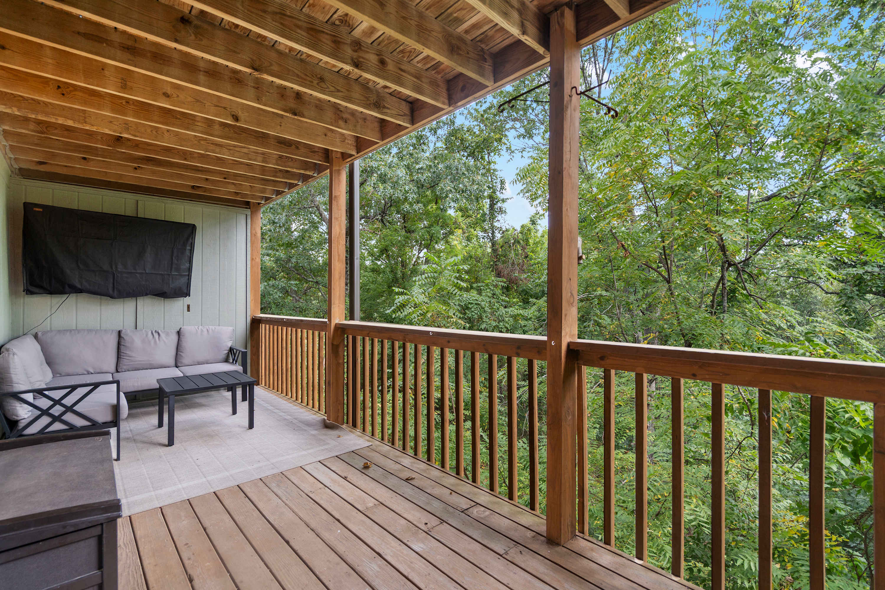 Lounge the day away with treetop views on the deck