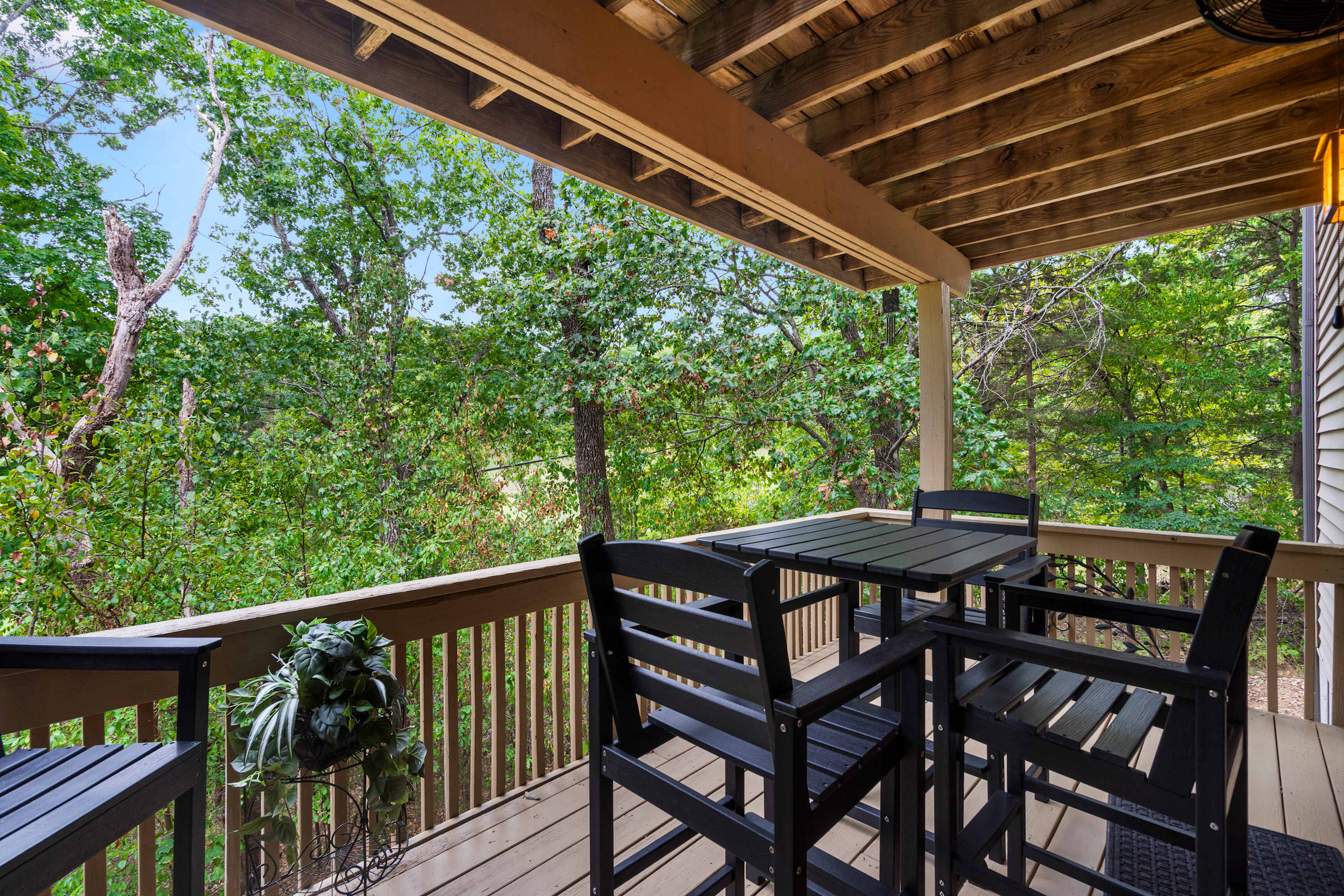 Lounge the day away or dine alfresco with treetop views on the balcony​