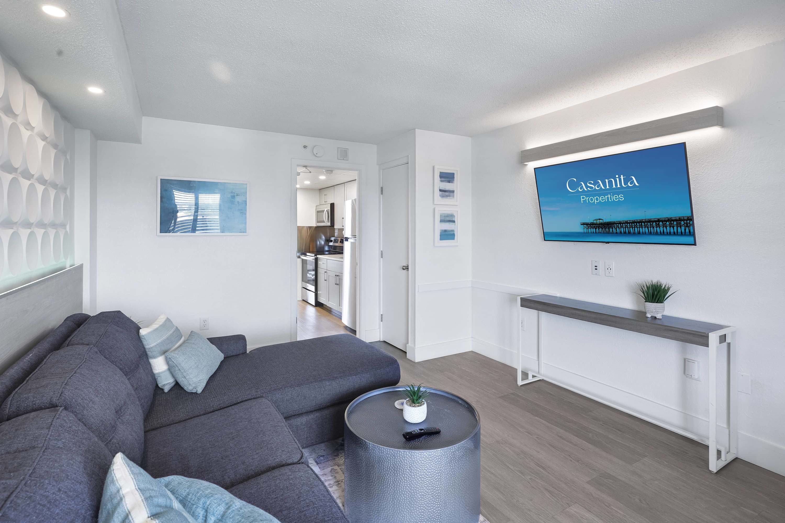 Relax and unwind in this spacious living area with comfortable seating and a large flat-screen TV