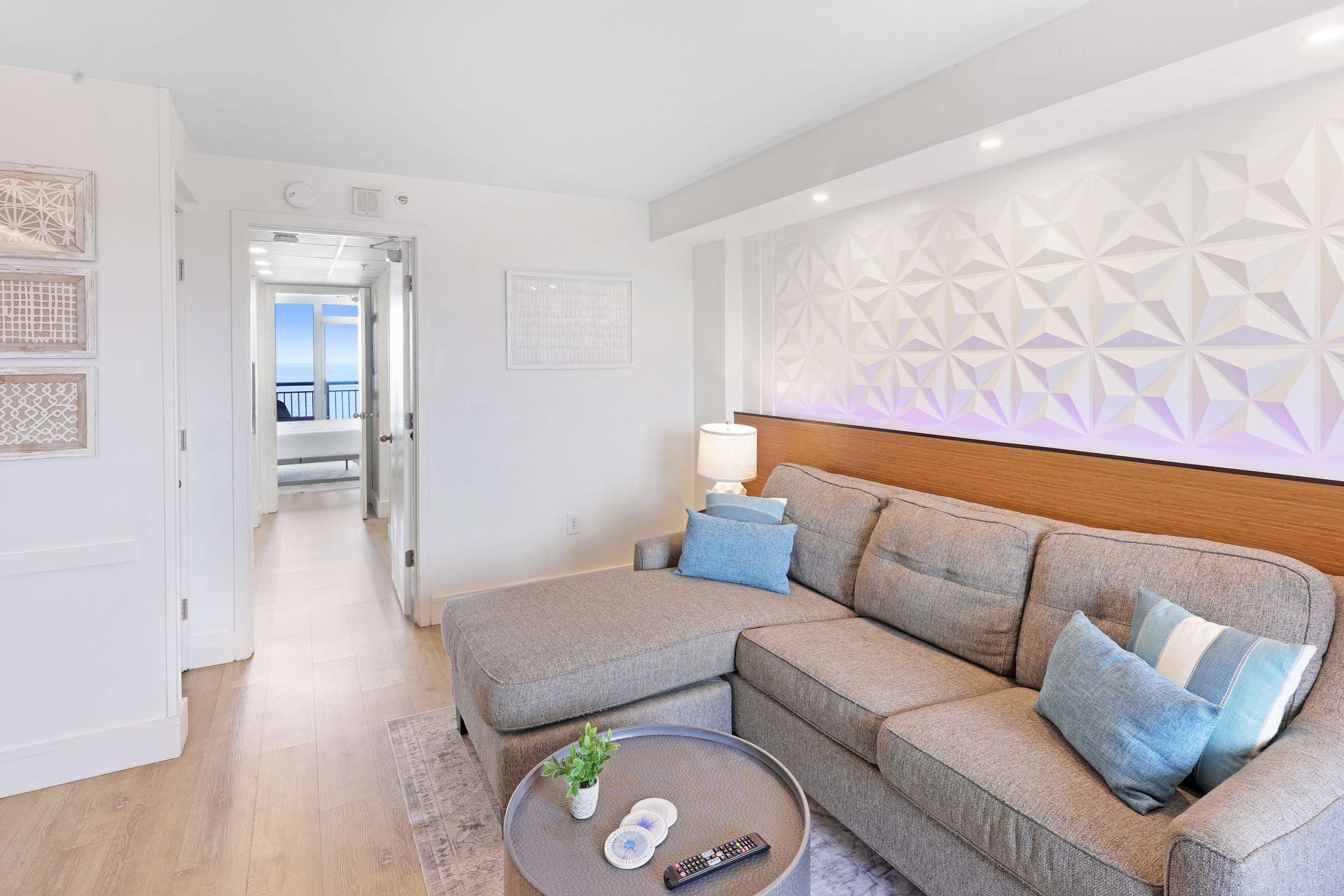 Unwind in style in our spacious living area, featuring LED mood lighting, plush seating, and a flat-screen TV for entertainment.
