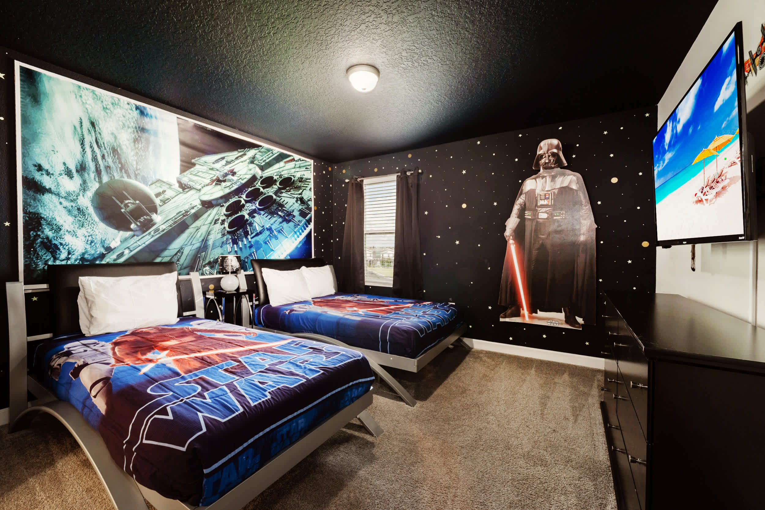 Step into a galaxy far, far away in this Star Wars themed room with twin beds and immersive decor, perfect for fans of all ages.