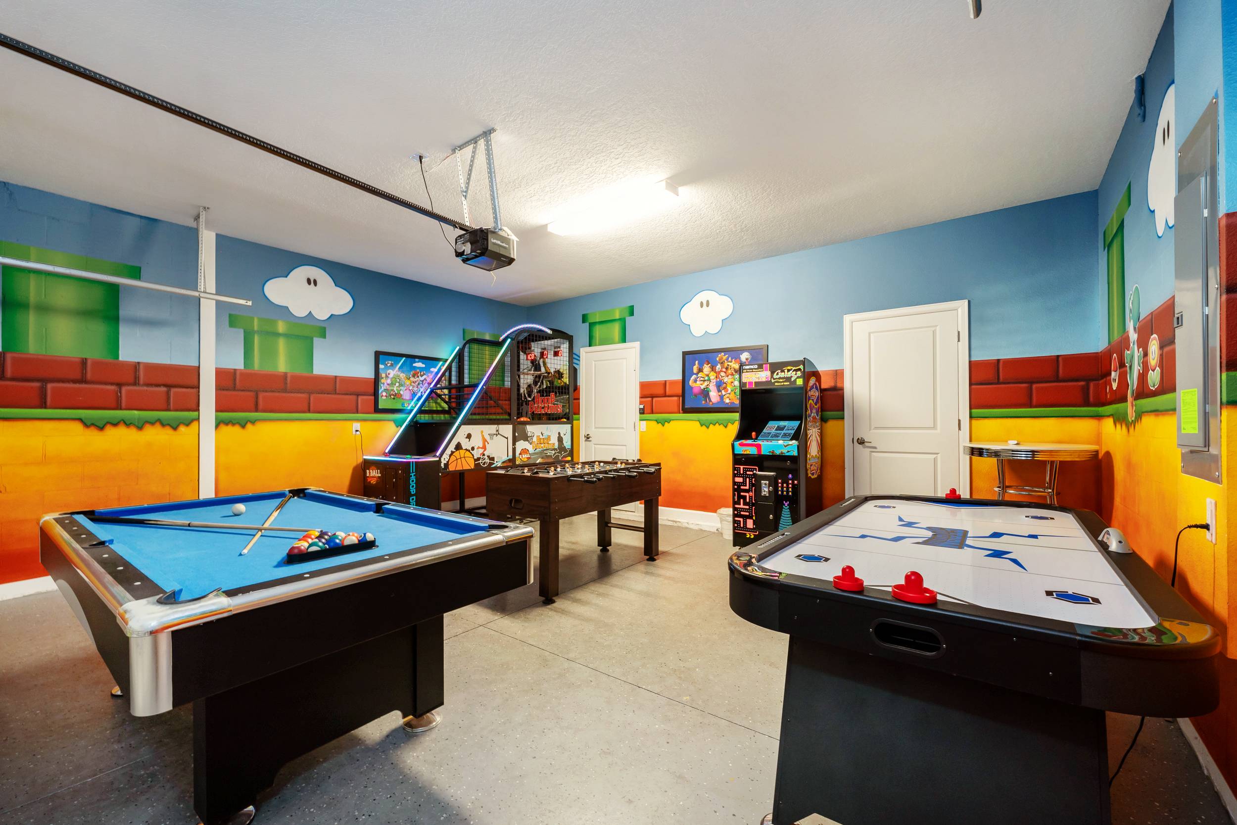 Dive into fun in this vibrant game room with pool, air hockey, and arcade games—perfect for family entertainment!