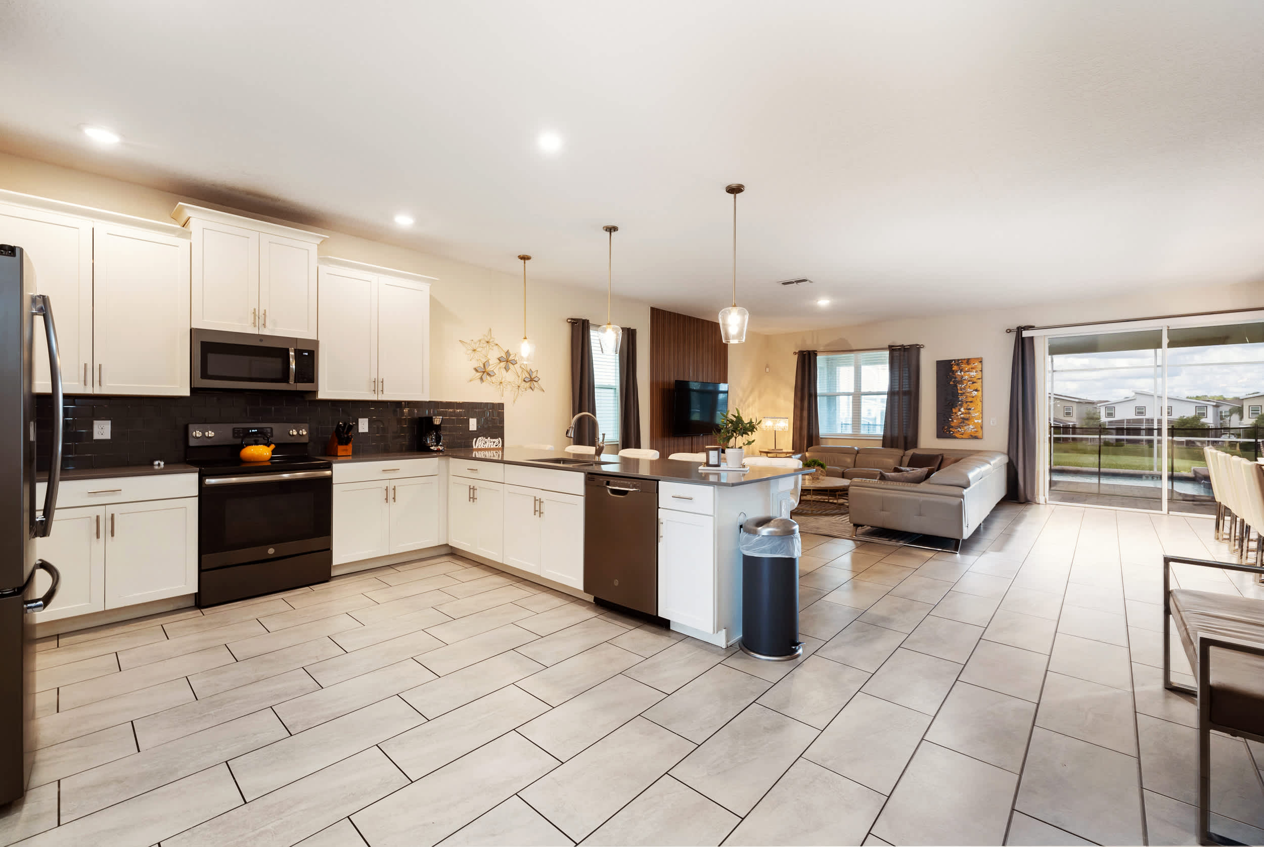 Spacious open-plan kitchen and living area, perfect for entertaining with modern amenities and abundant natural light.