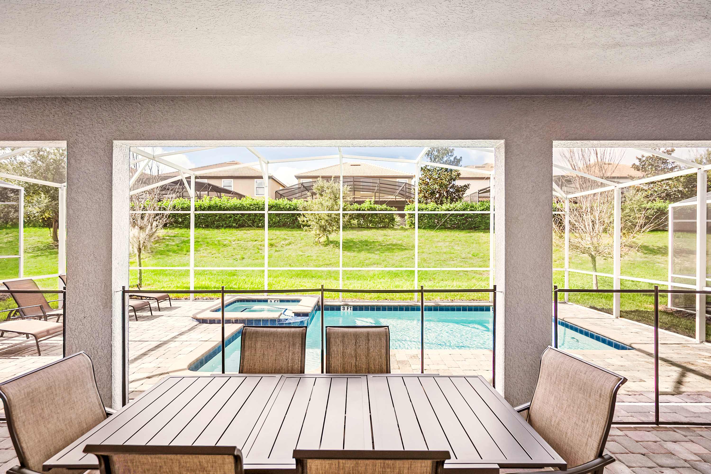 Dine al fresco by your private pool and spa, surrounded by lush greenery for a serene escape.