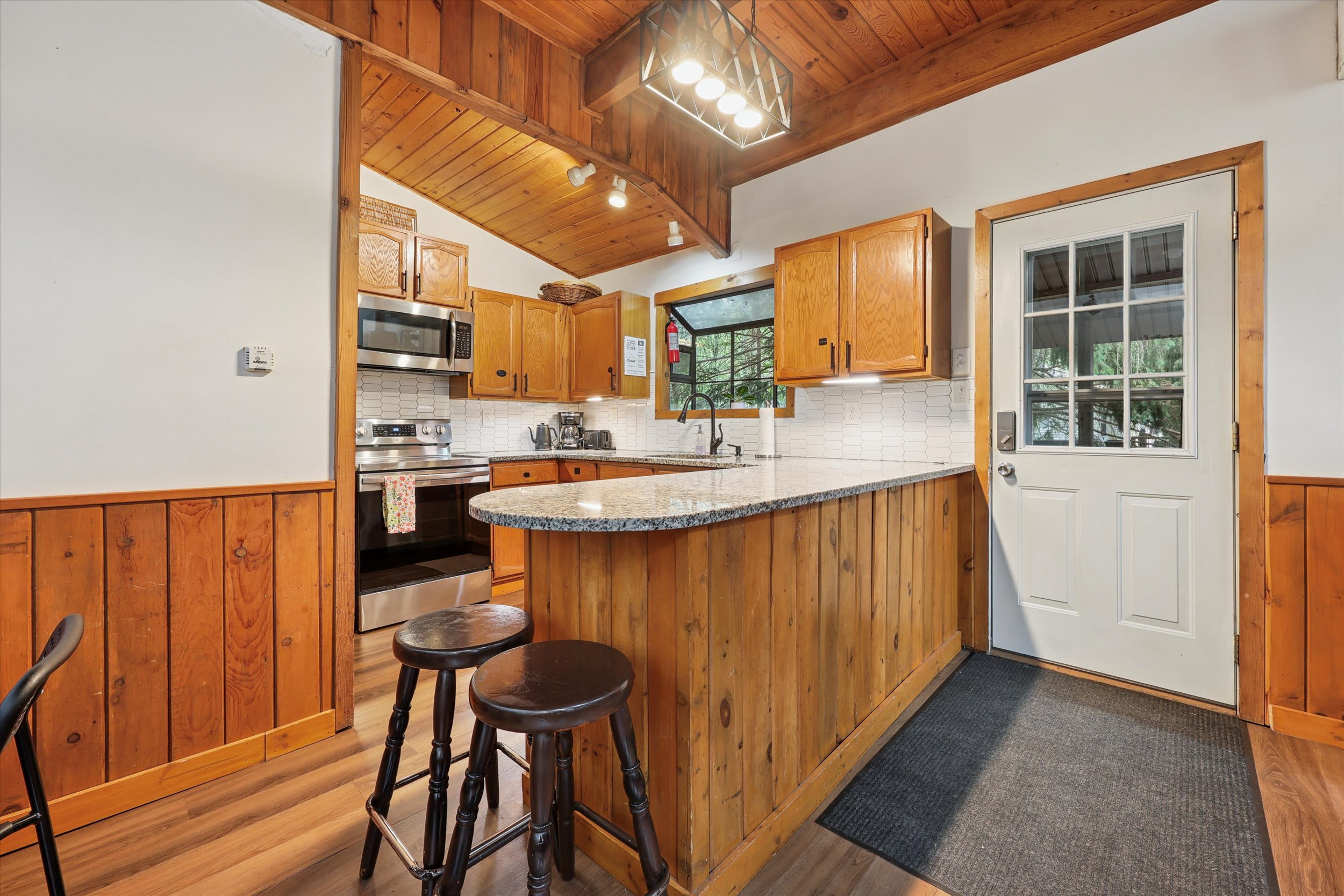 Cook up your favorite meals in the fully stocked kitchen with breakfast bar seating.