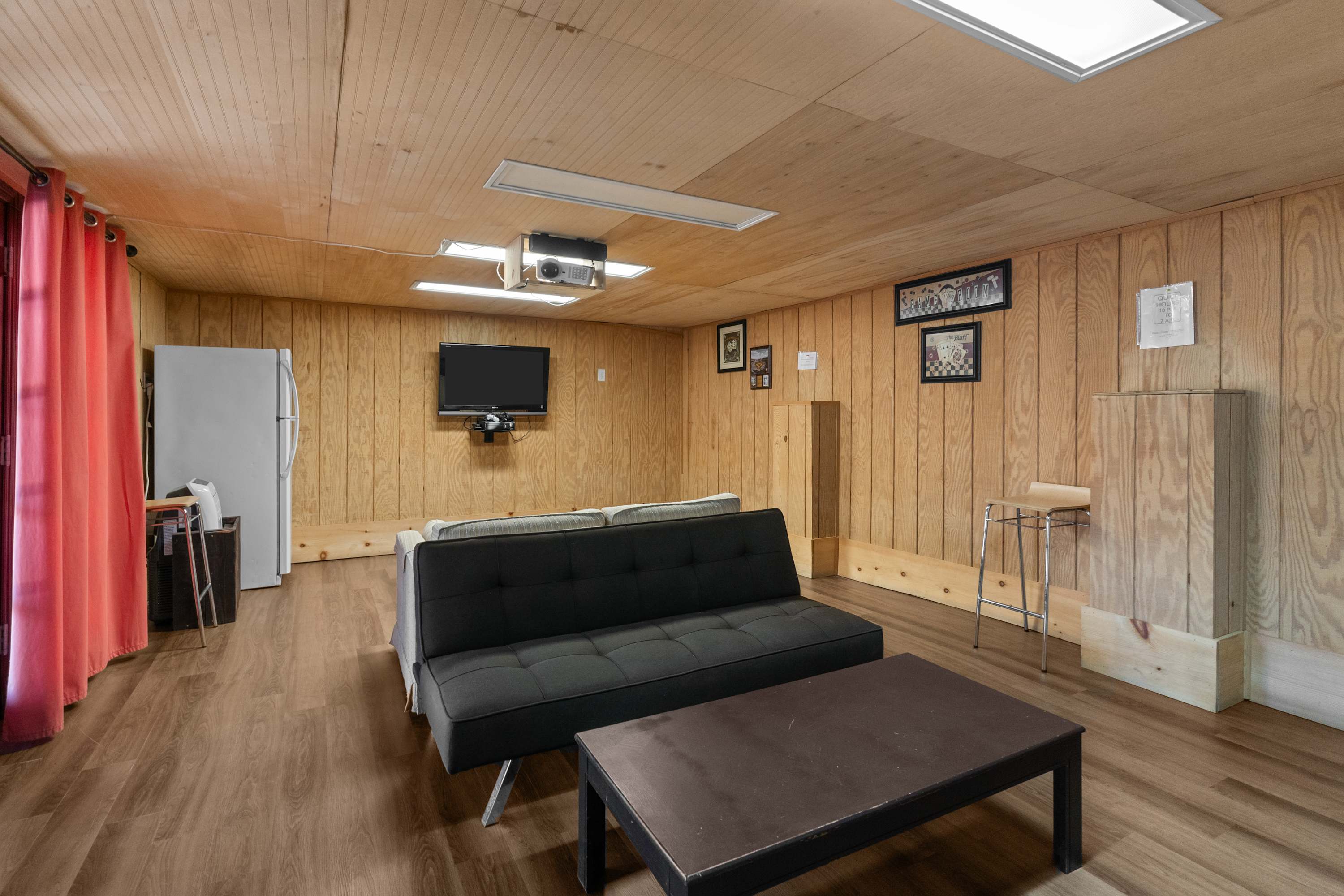 The entertainment space doubles as a hangout with a futon, and TV for smaller gatherings.