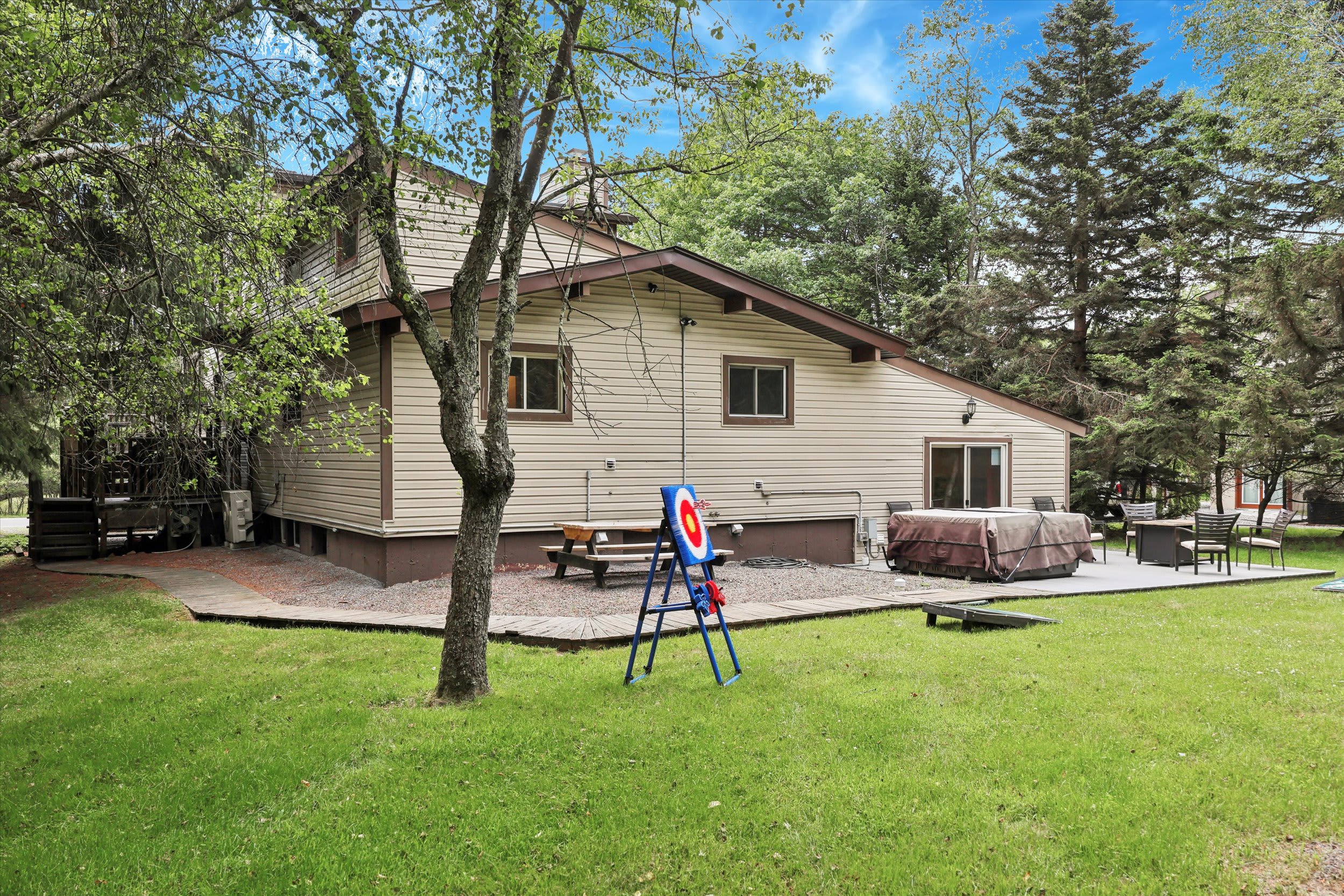 Your lakeside retreat awaits with a spacious deck perfect for outdoor relaxation.
