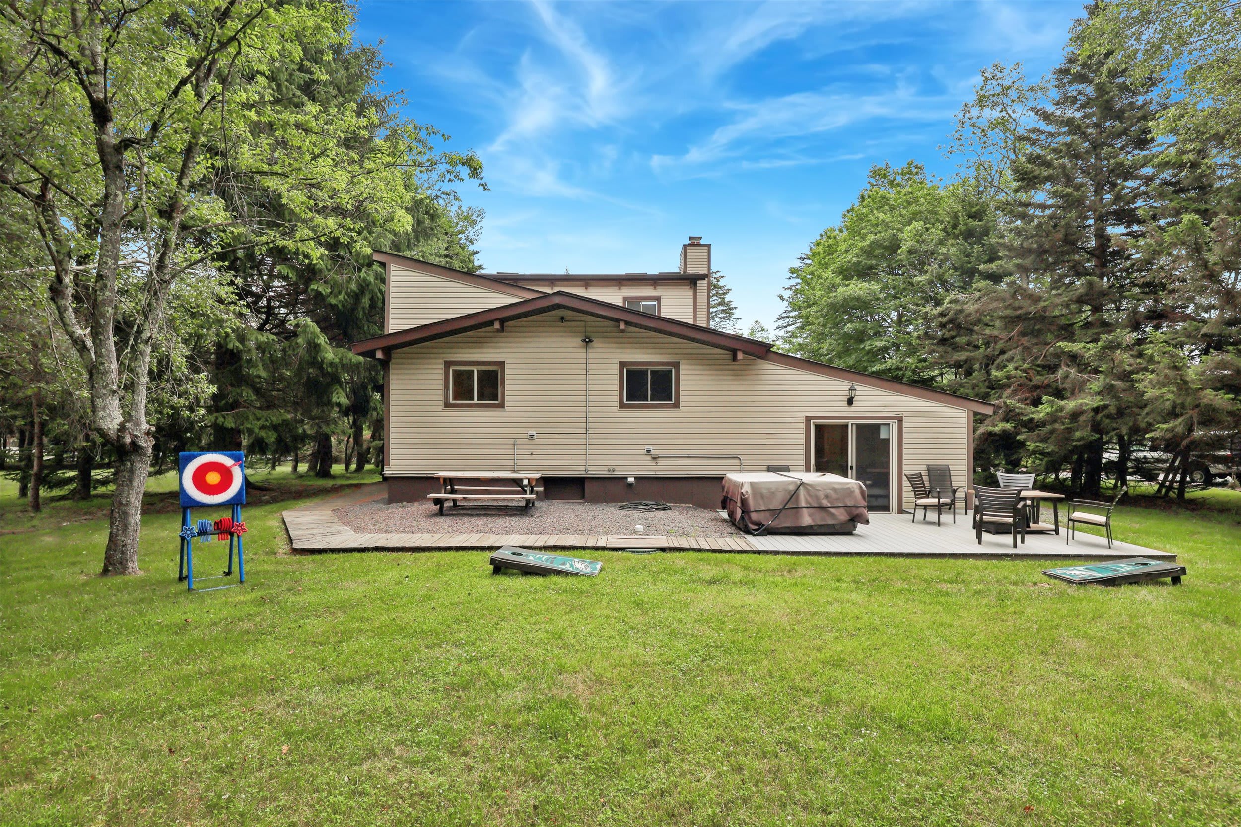 Spread out in the spacious backyard with outdoor games, a grill, and room to roam.