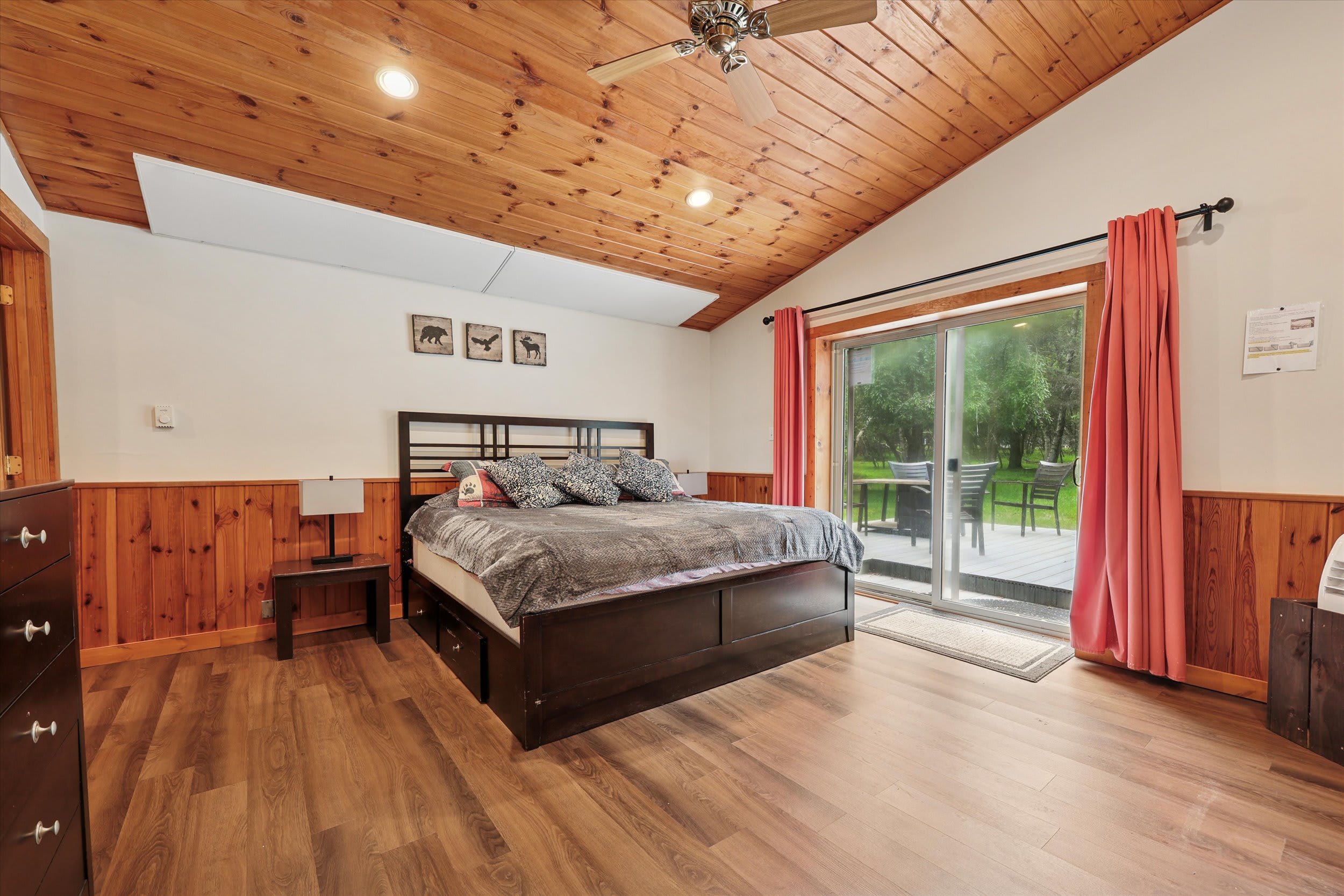 Unwind in this charming bedroom with warm wood floors and natural light.