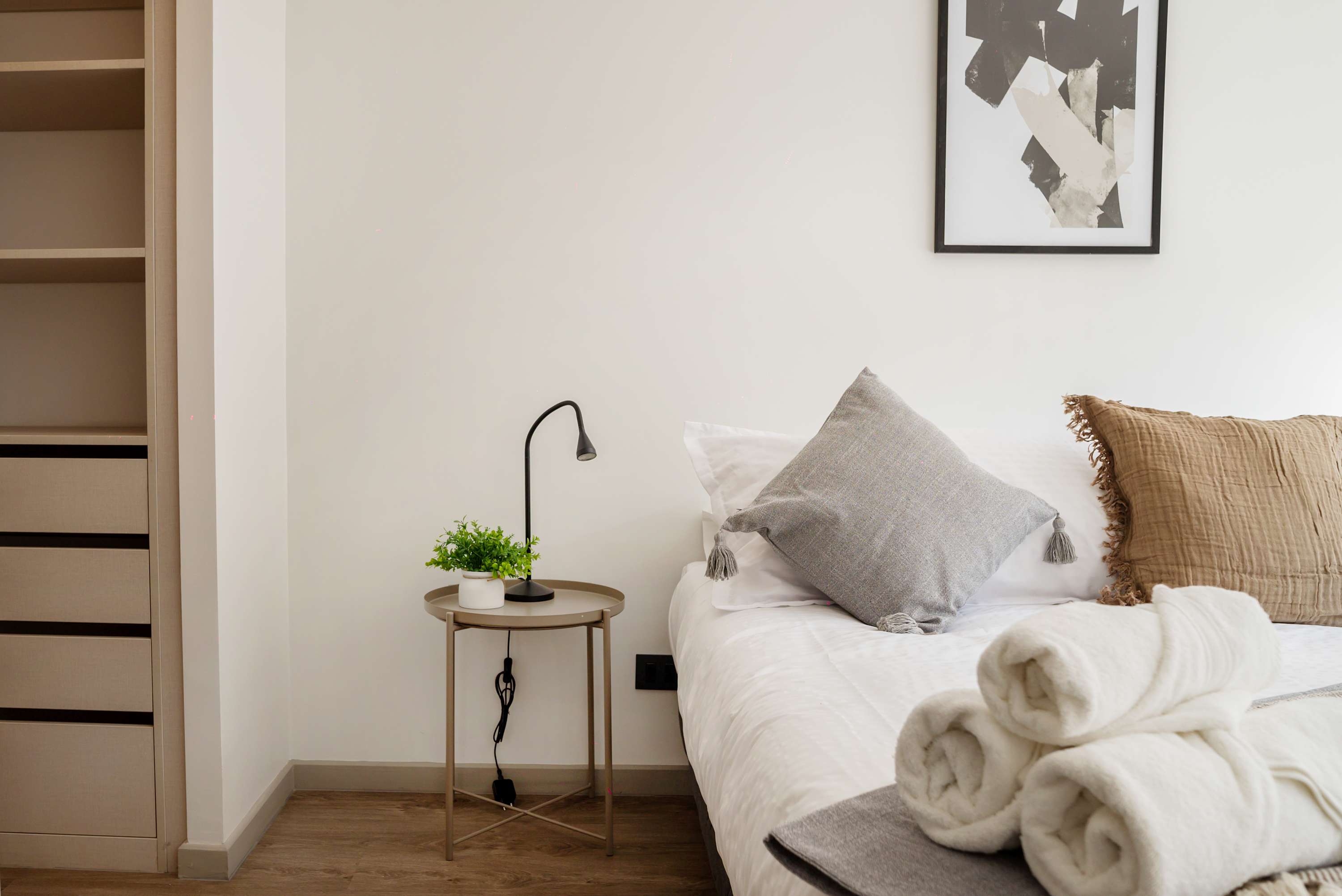 Relax in this cozy bedroom with modern decor and soft lighting, perfect for unwinding after a day of exploring.
