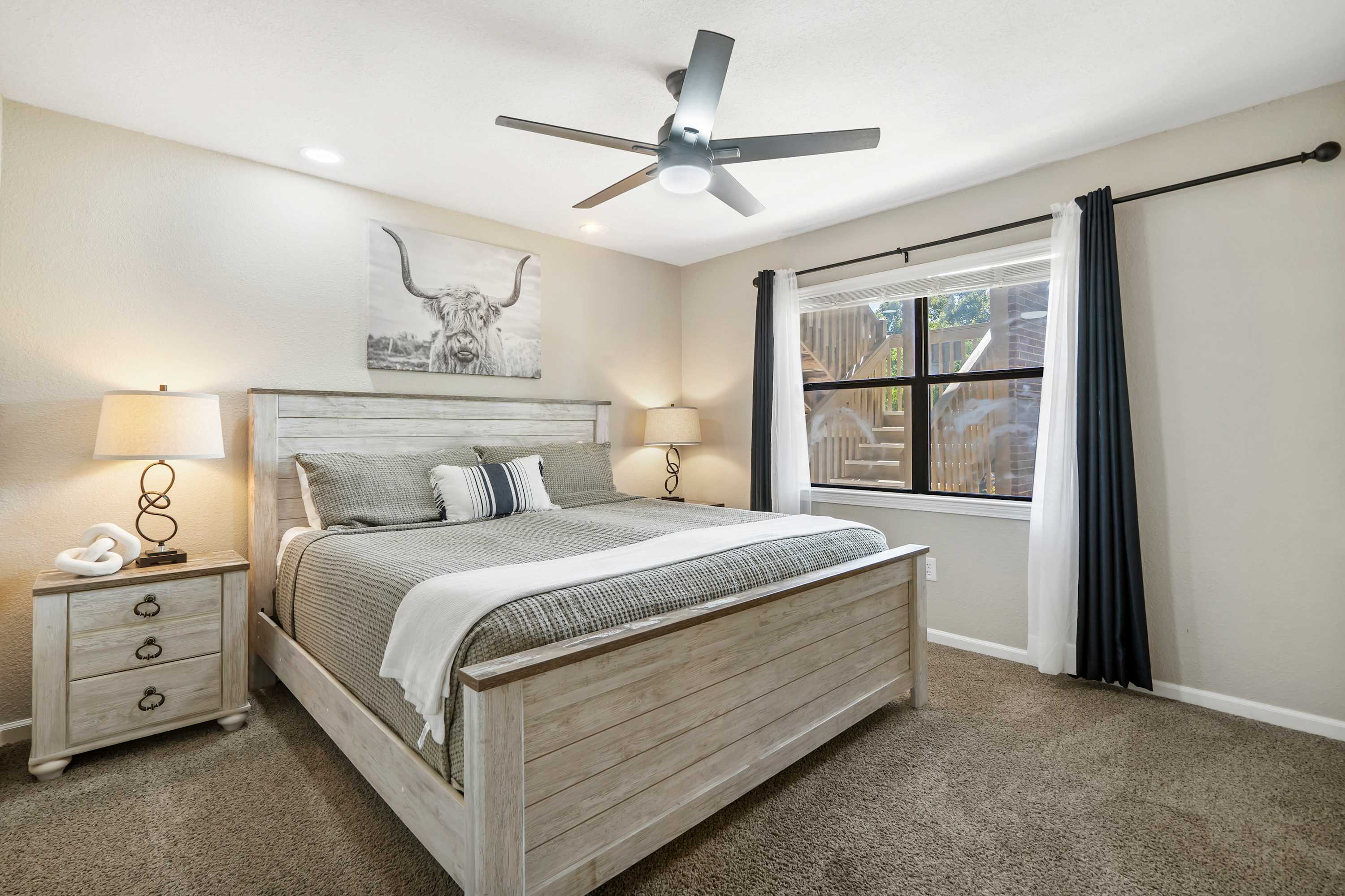 Recharge in the first bedroom retreat, featuring a plush king bed & smart TV​