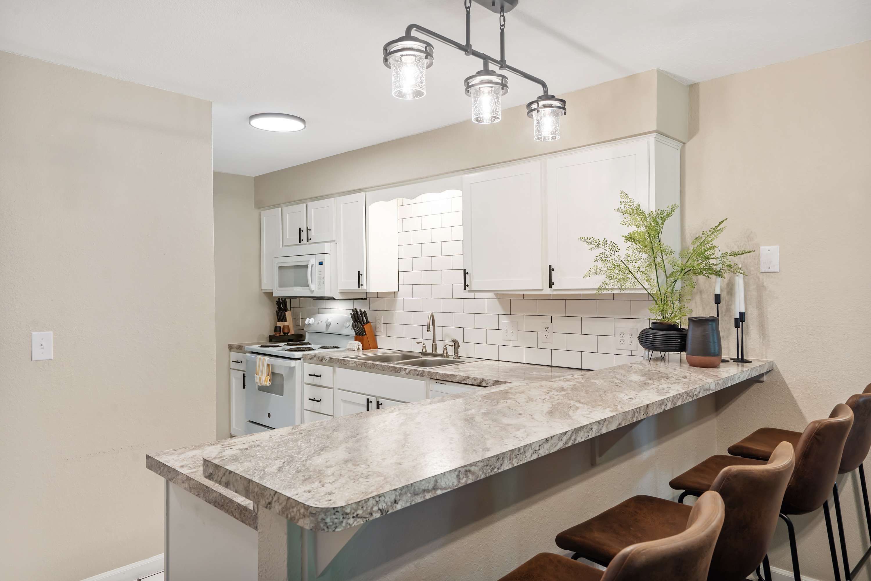The open kitchen offers ample space & all the comforts of home​