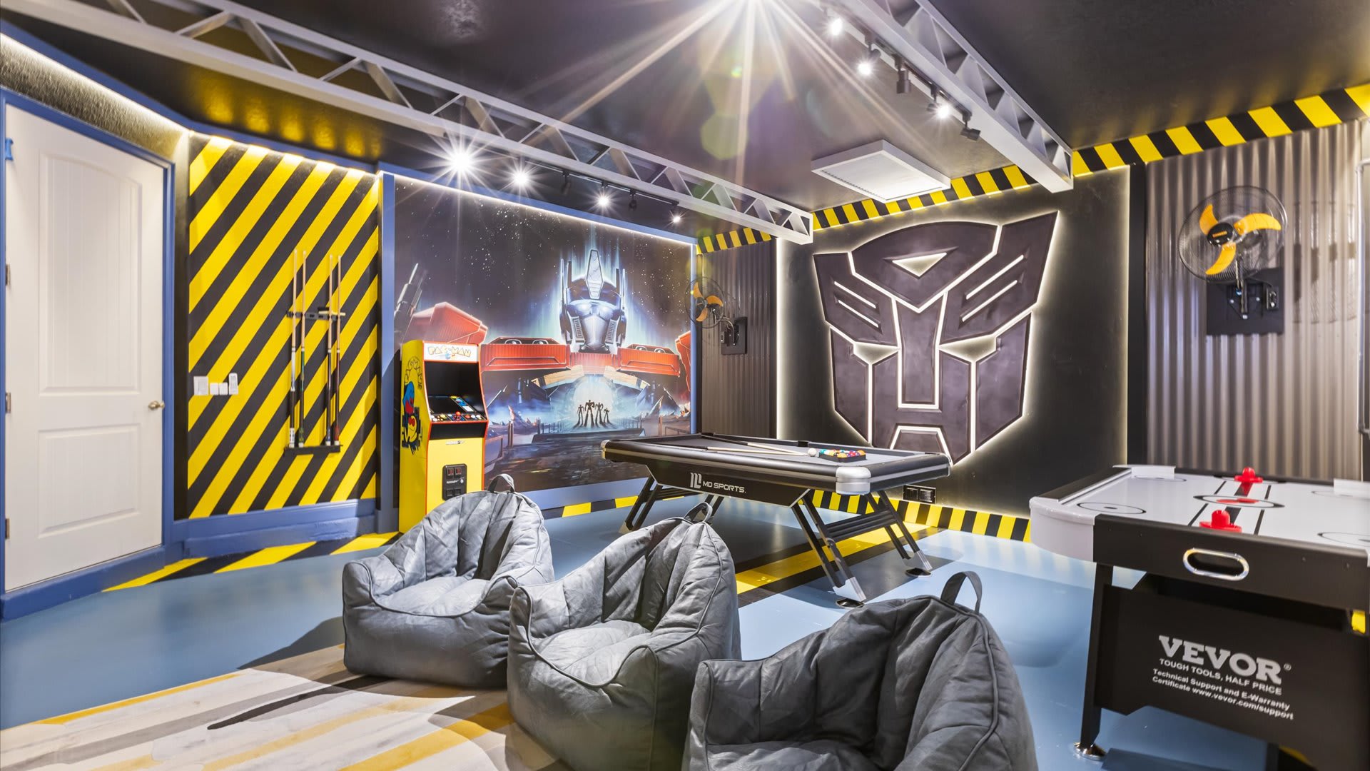 Transformers themed games room with air hockey and billiards table