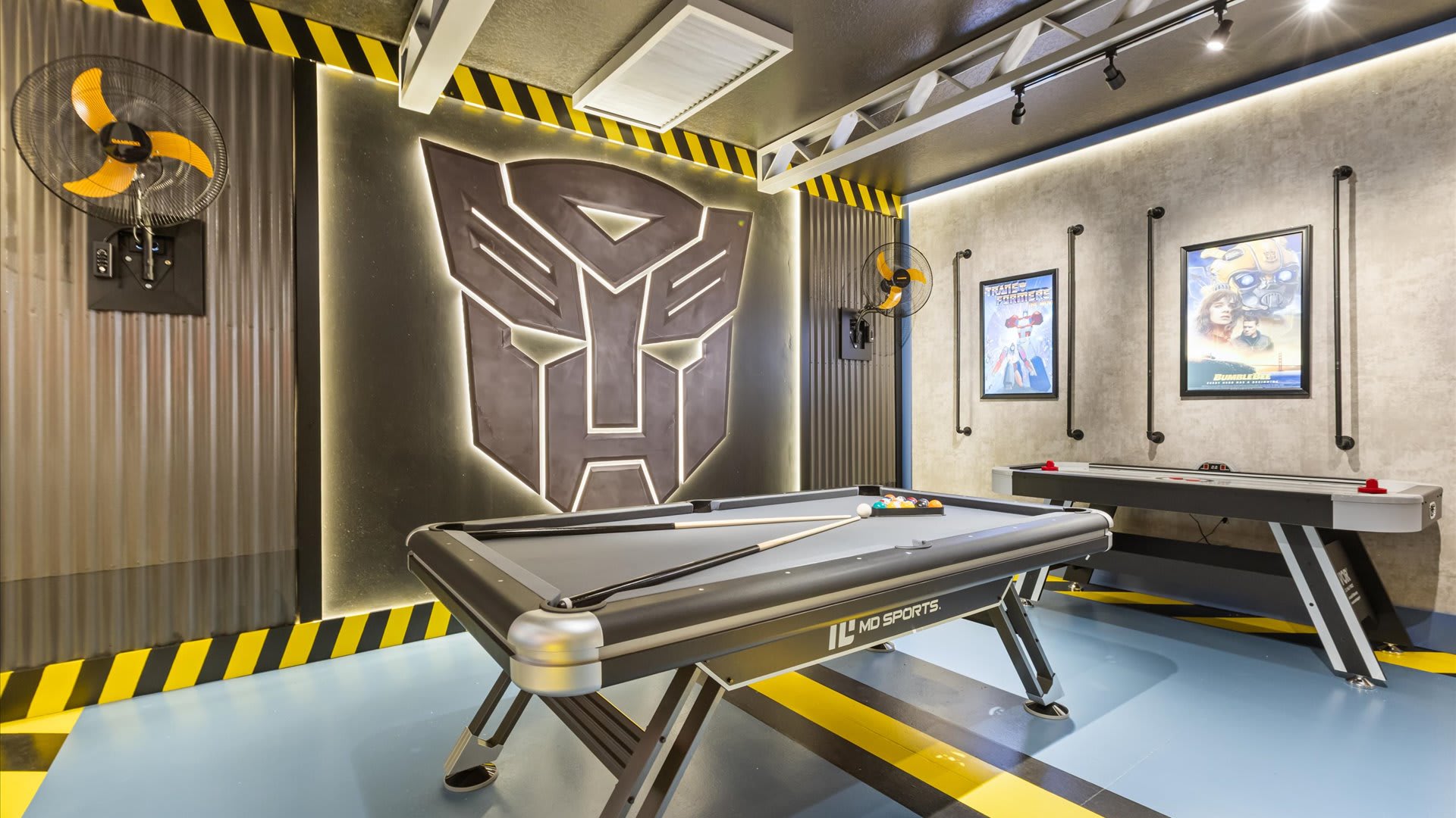 Transformers themed games room with air hockey and billiards table