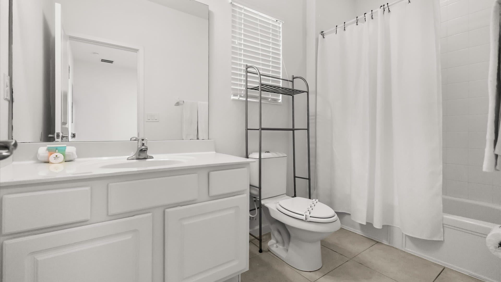 Full bathroom with combined bathtub and shower