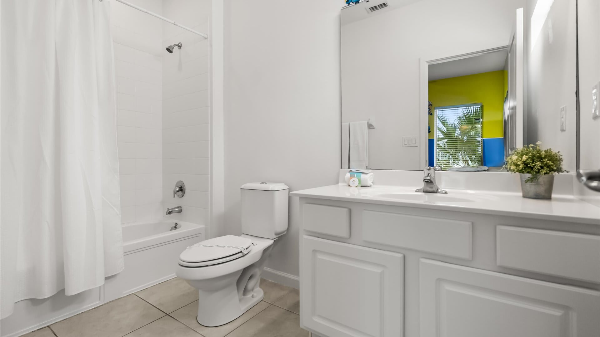 Full bathroom with combined bathtub and shower