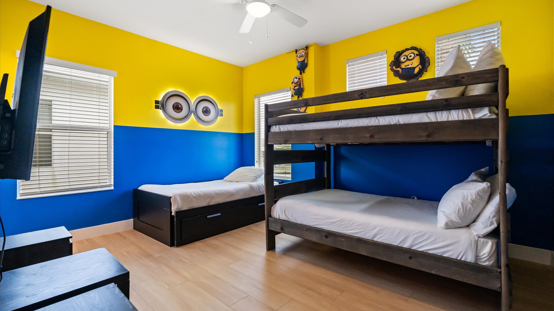 Minions bedroom with 2 full bunkbeds and a smart TV
