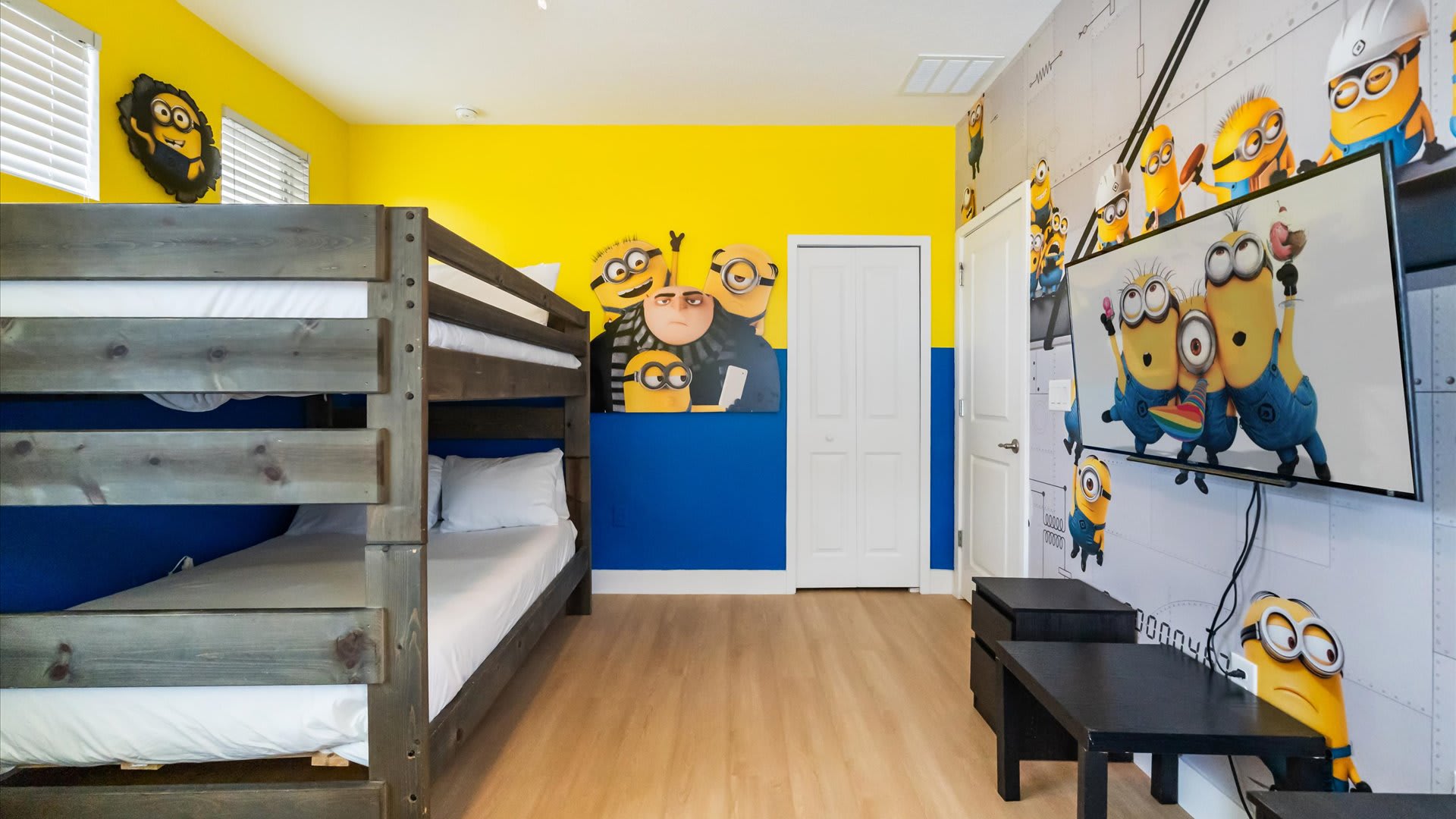 Minions bedroom with 2 full bunkbeds and a smart TV