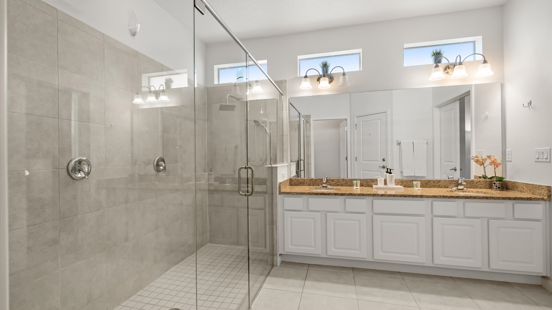 Spacious en-suite bathroom with large standing shower and double vanity