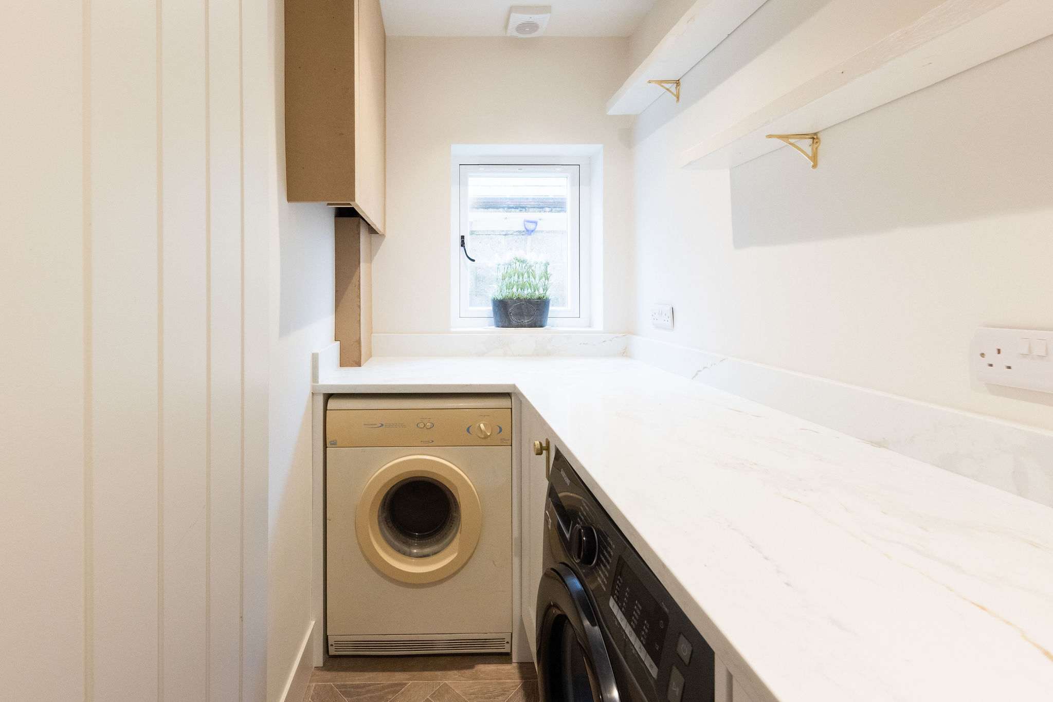 A dedicated utility room with a washer and dryer, ensuring a convenient and easy stay.