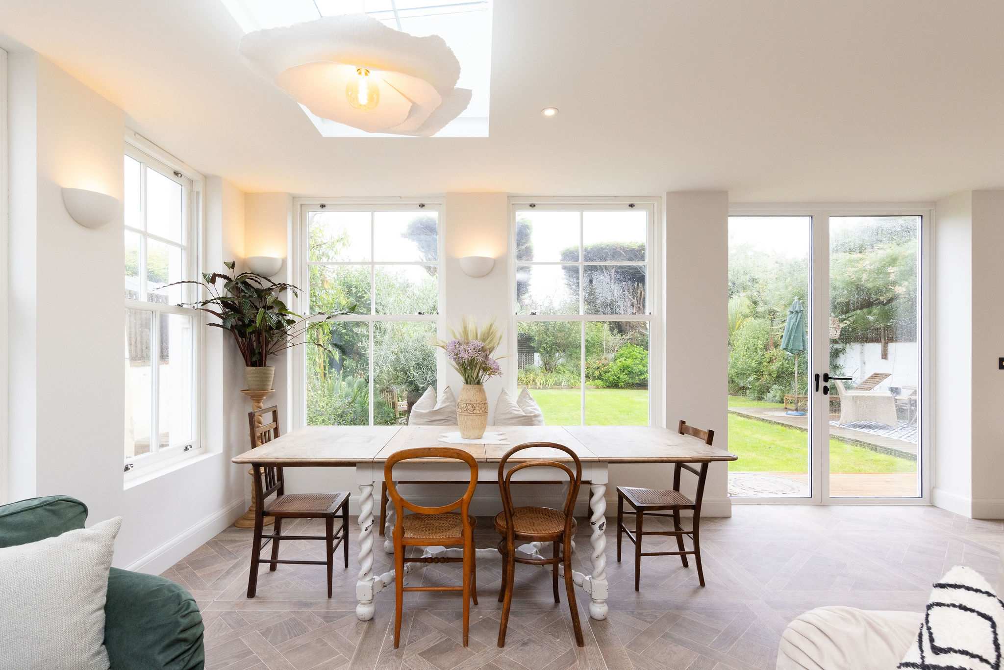 Dine with serene views of the garden, bringing the beauty of the outdoors in.