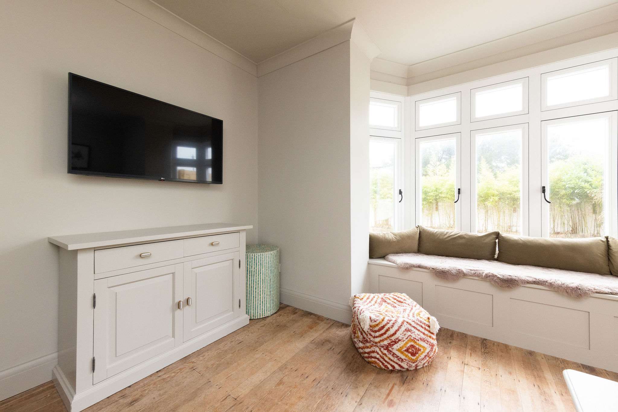 The perfect spot for a movie night, with a Smart TV and a sunny window seat.