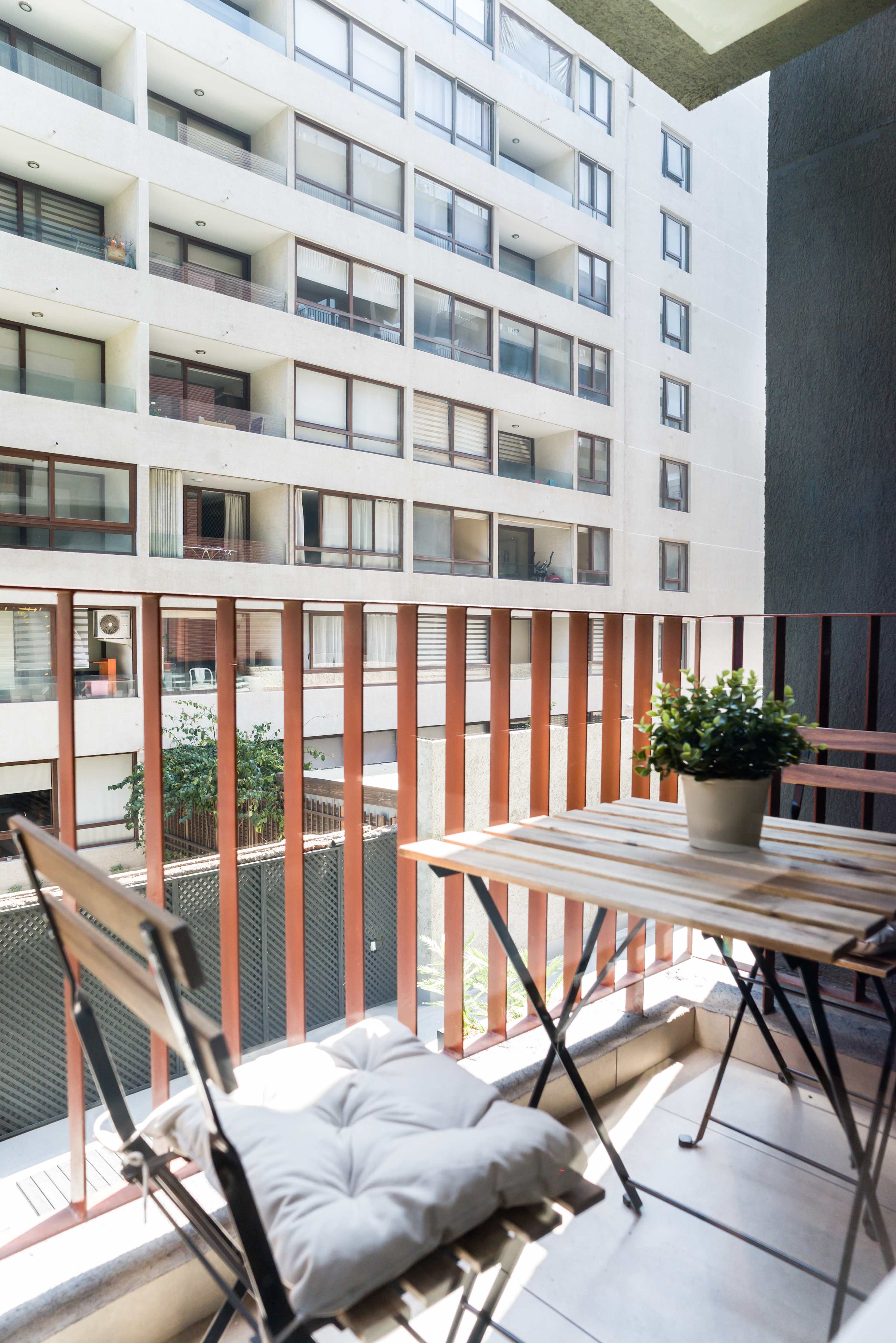 Cozy balcony perfect for enjoying a morning coffee with city views.